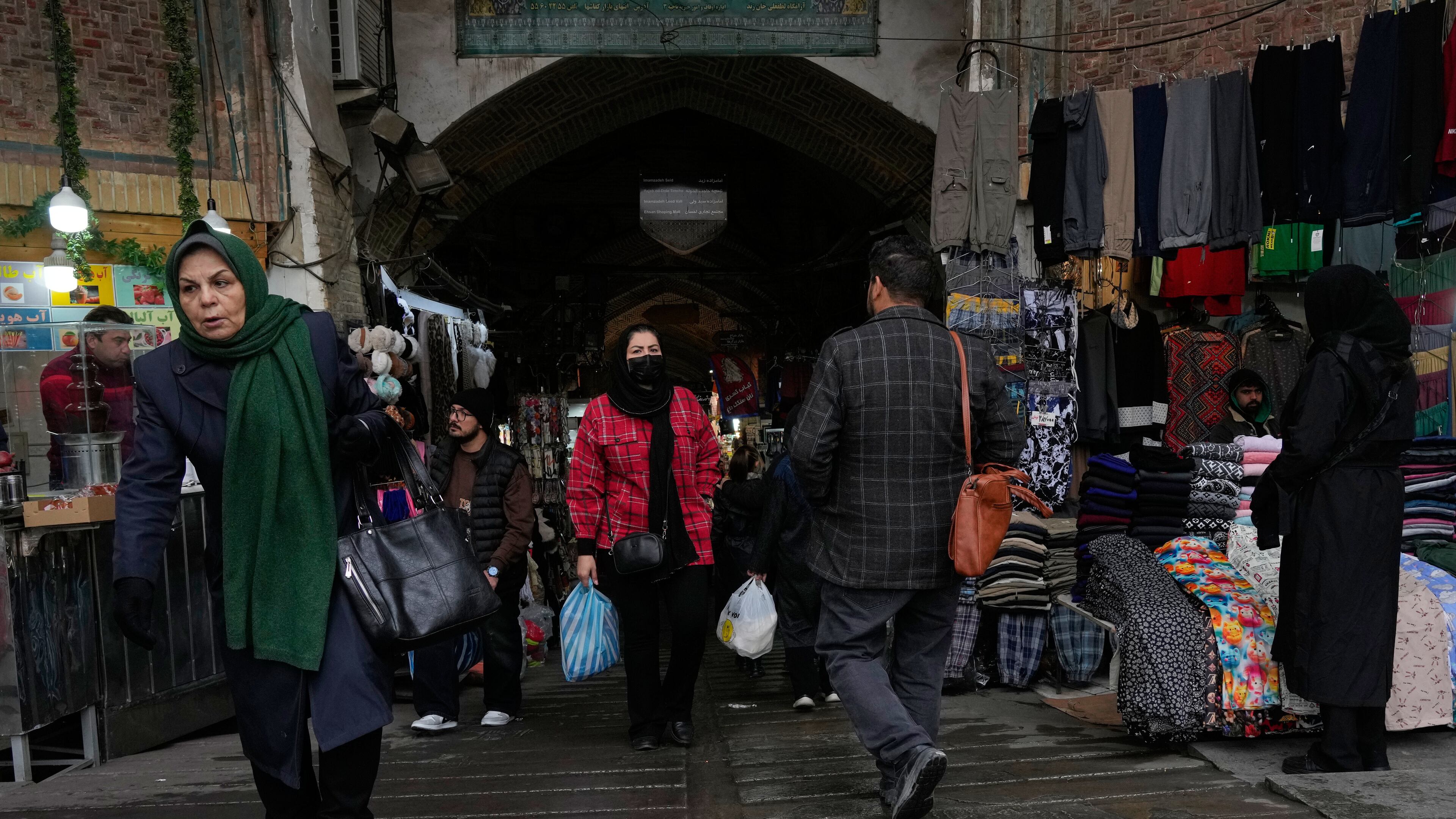 People walk at Tehran's historic Grand Bazaar, Tuesday, Jan. 20, 2026, in Iran. (AP Photo/Vahid Salemi)