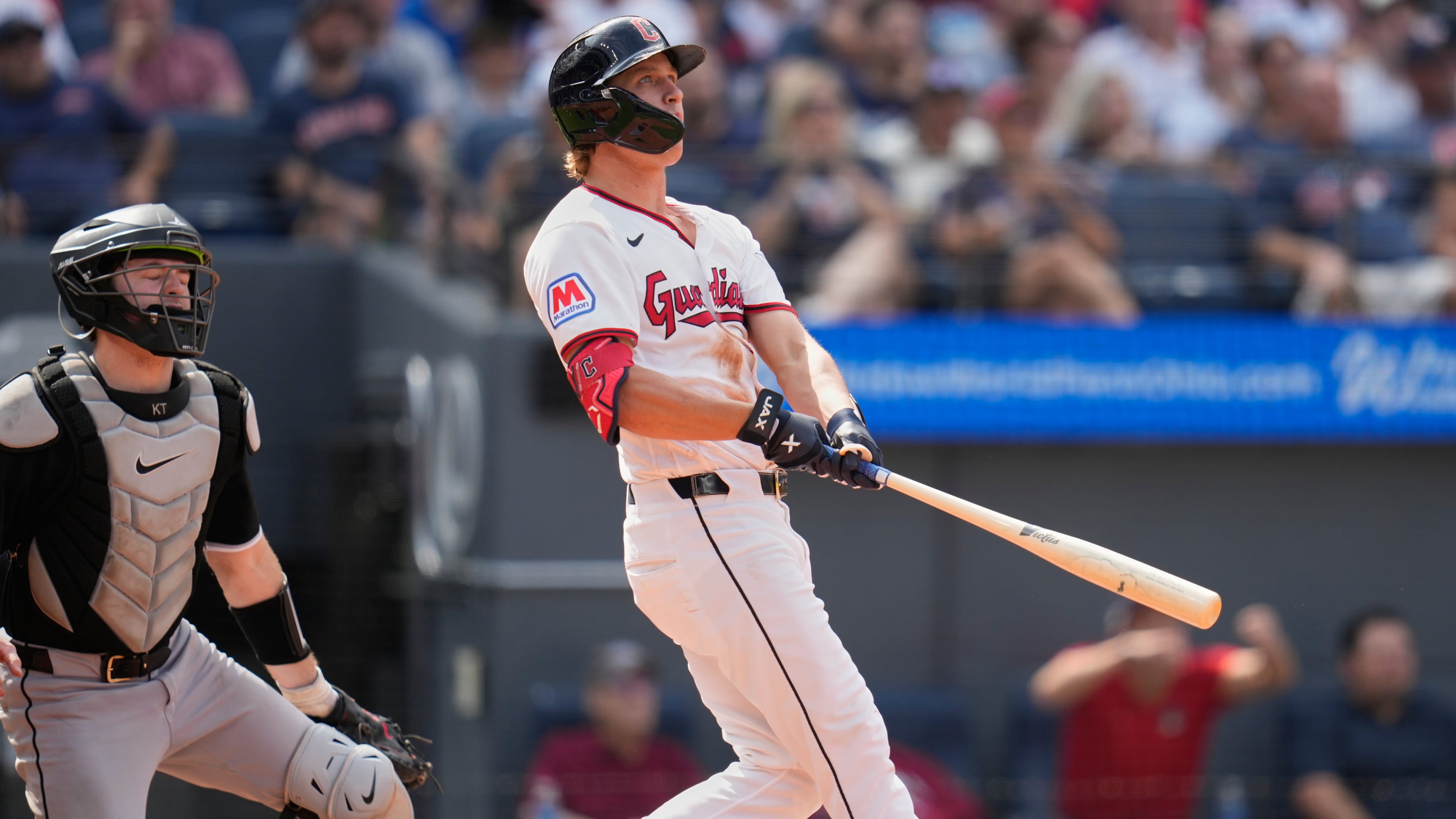 Cleveland Guardians' Petey Halpin, right, and catcher Kyle Teel, left, watch Halpin''s three-run home run in the sixth inning of a baseball game in Cleveland, Wednesday, Sept. 16, 2026. (AP Photo/Sue Ogrocki)