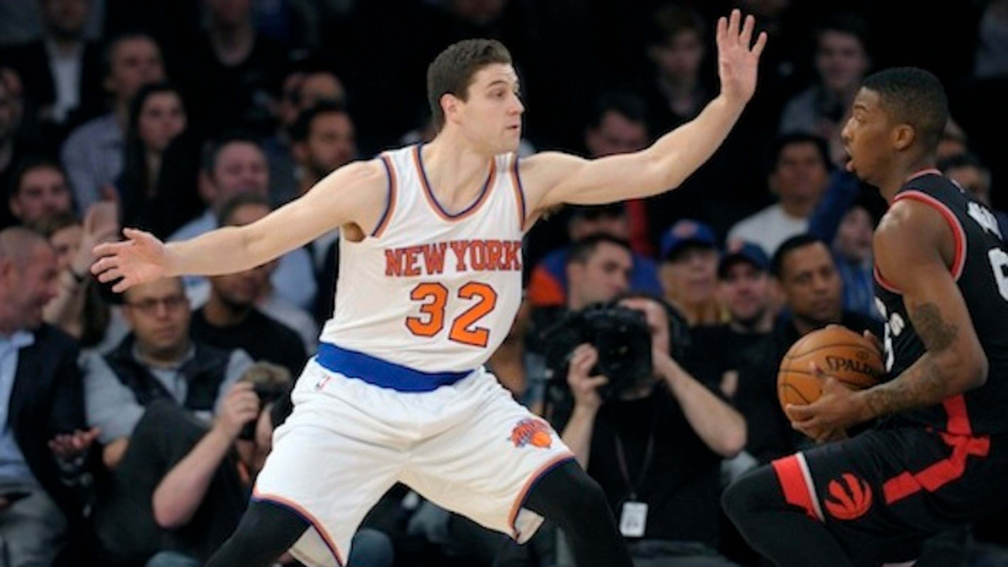 New York Knicks guard Jimmer Fredette (32) guards Toronto Raptors' Deion Wright during the fourth quarter of an NBA basketball game against the Toronto Raptors Monday, Feb. 22, 2016, at Madison Square Garden in New York. The Raptors won 122-95. (AP Photo/Bill Kostroun)