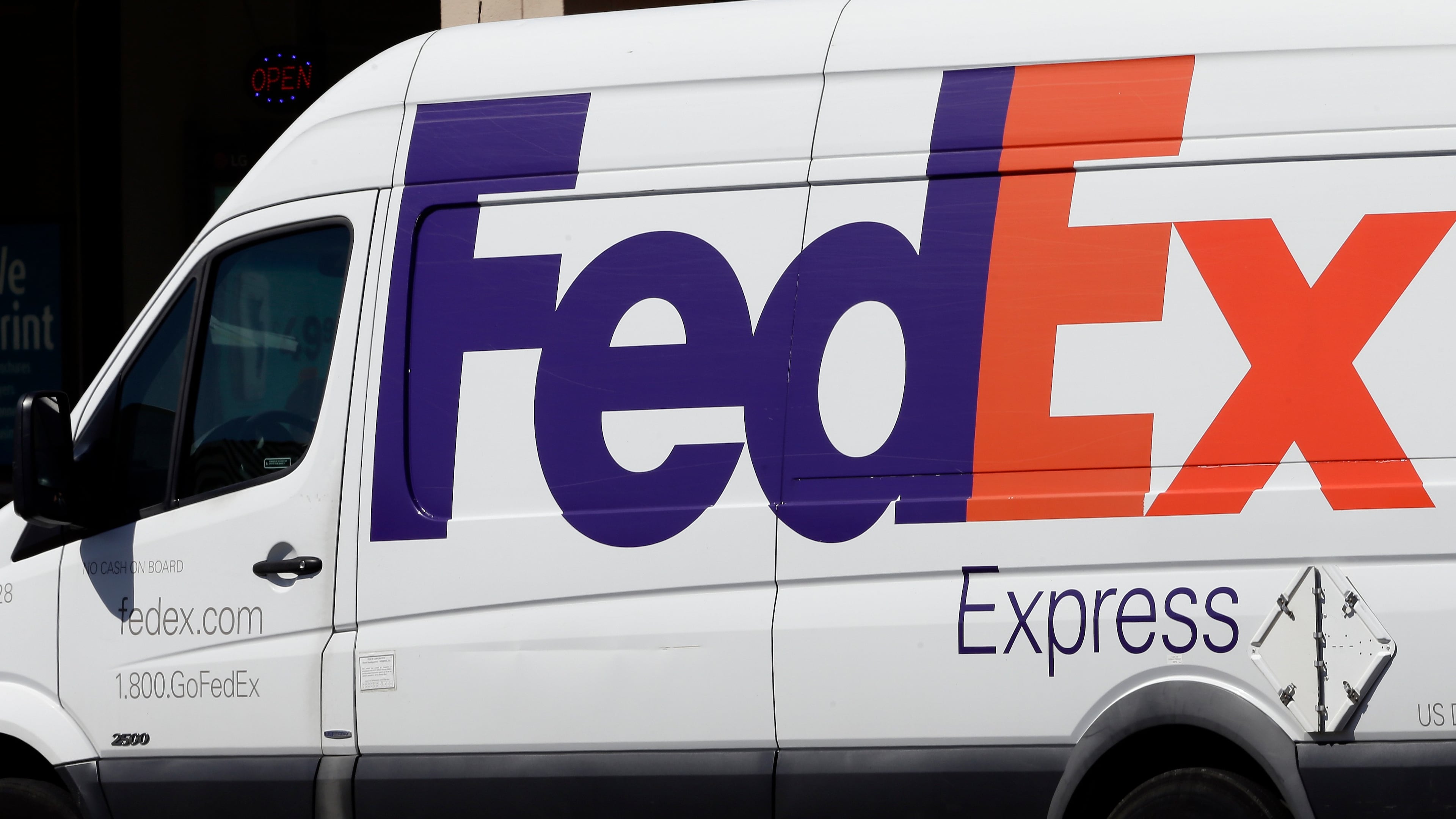 FILE - A Fed Ex truck sits during a delivery June 26, 2019, in Chapel Hill, N.C. (AP Photo/Gerry Broome, File)