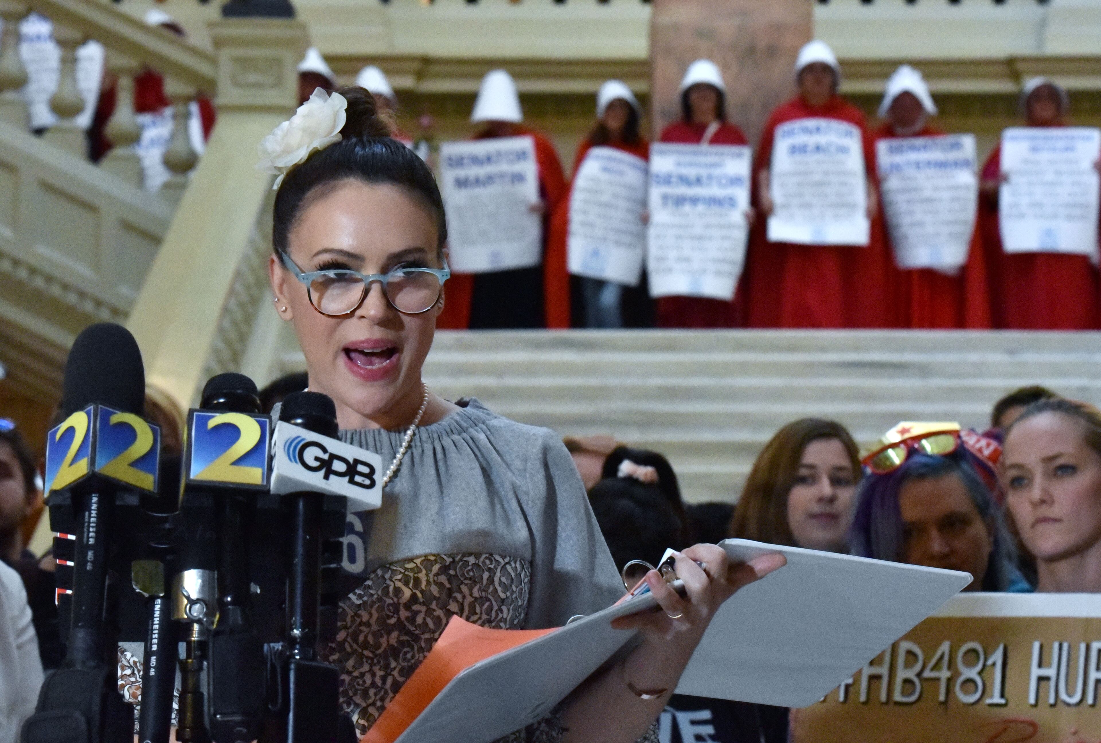 Actress Alyssa Milano speaks to members of the press after she delivered a letter to Gov. Brian Kemp threatening to boycott the state and urging him not to sign HB 481, a bill that would ban most abortions at about six weeks into a pregnancy, before many women know they are pregnant. Kemp signed the bill into law, but a federal judge then put a hold on it. HYOSUB SHIN / HSHIN@AJC.COM