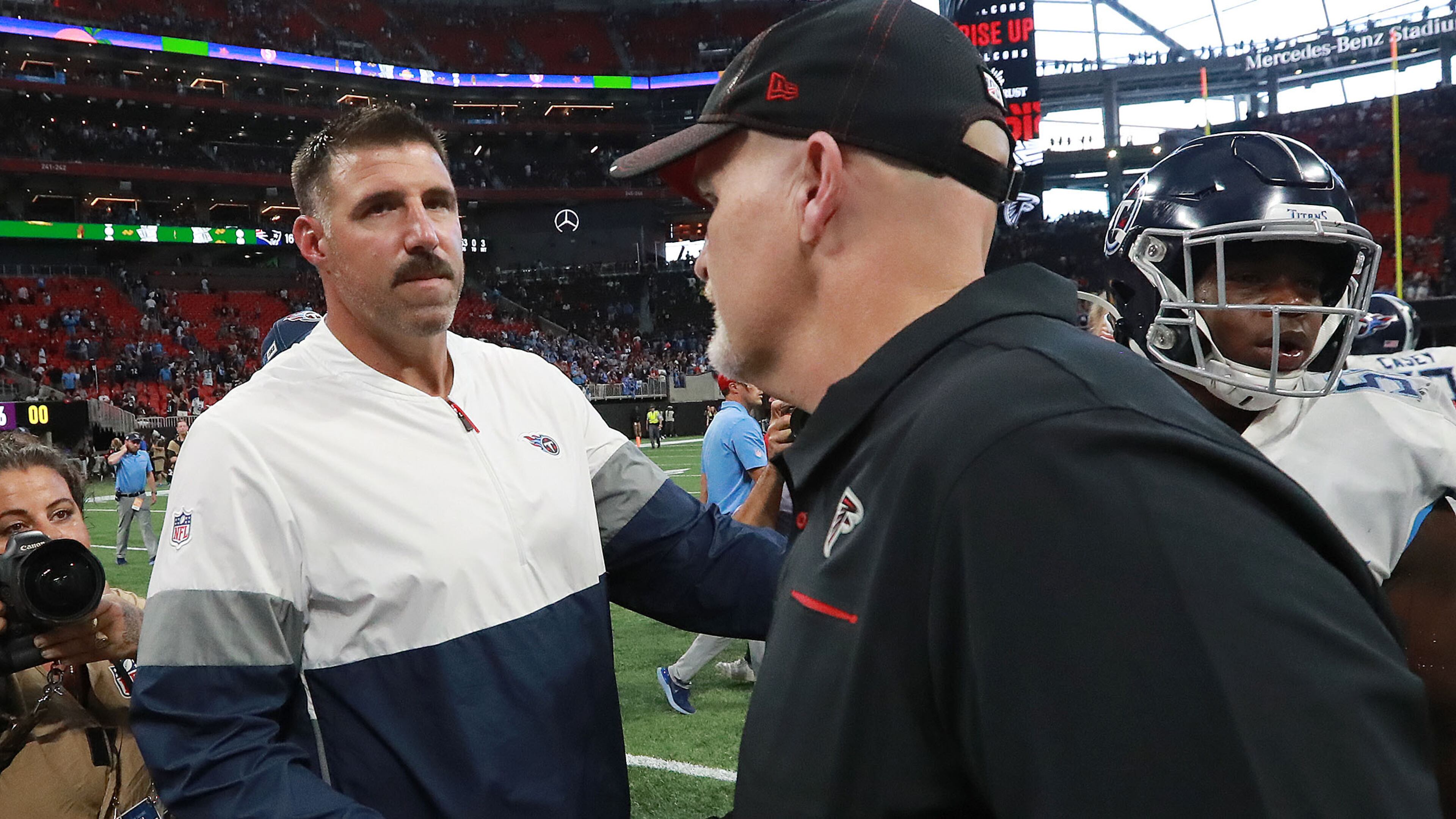 Falcons head coach Dan Quinn shakes hands with Titans head coach Mike Vrabel after the Titans' 24-10 win Sunday, Sept. 29, 2019, at Mercedes-Benz Stadium in Atlanta.