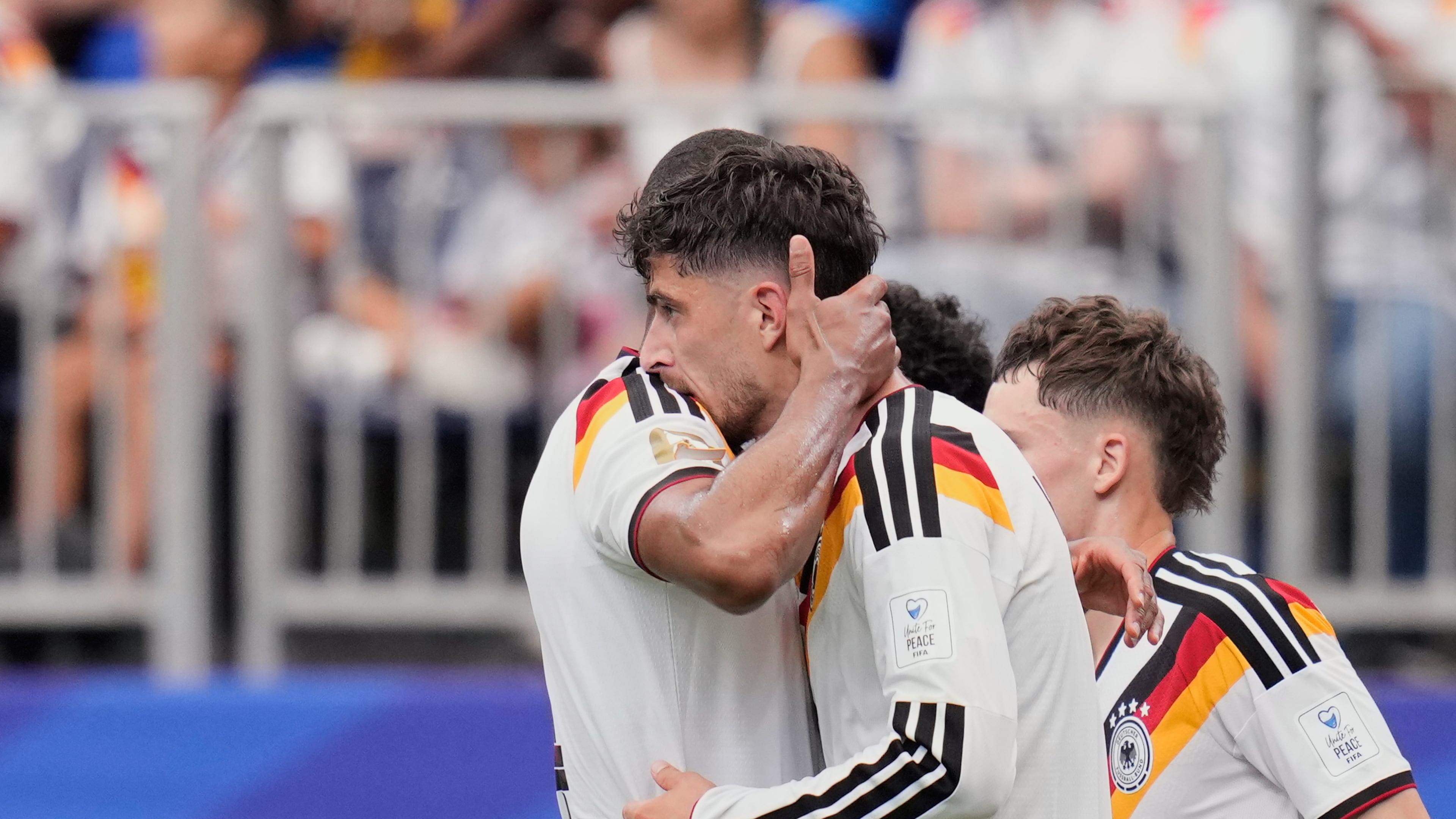 Germany's Kai Havertz celebrates with teammate Jonathan Tah, left, after scoring his side's third goal during the World Cup Group E soccer match between Germany and Curacao in Houston, Sunday, June 14, 2026. (AP Photo/Karen Warren)