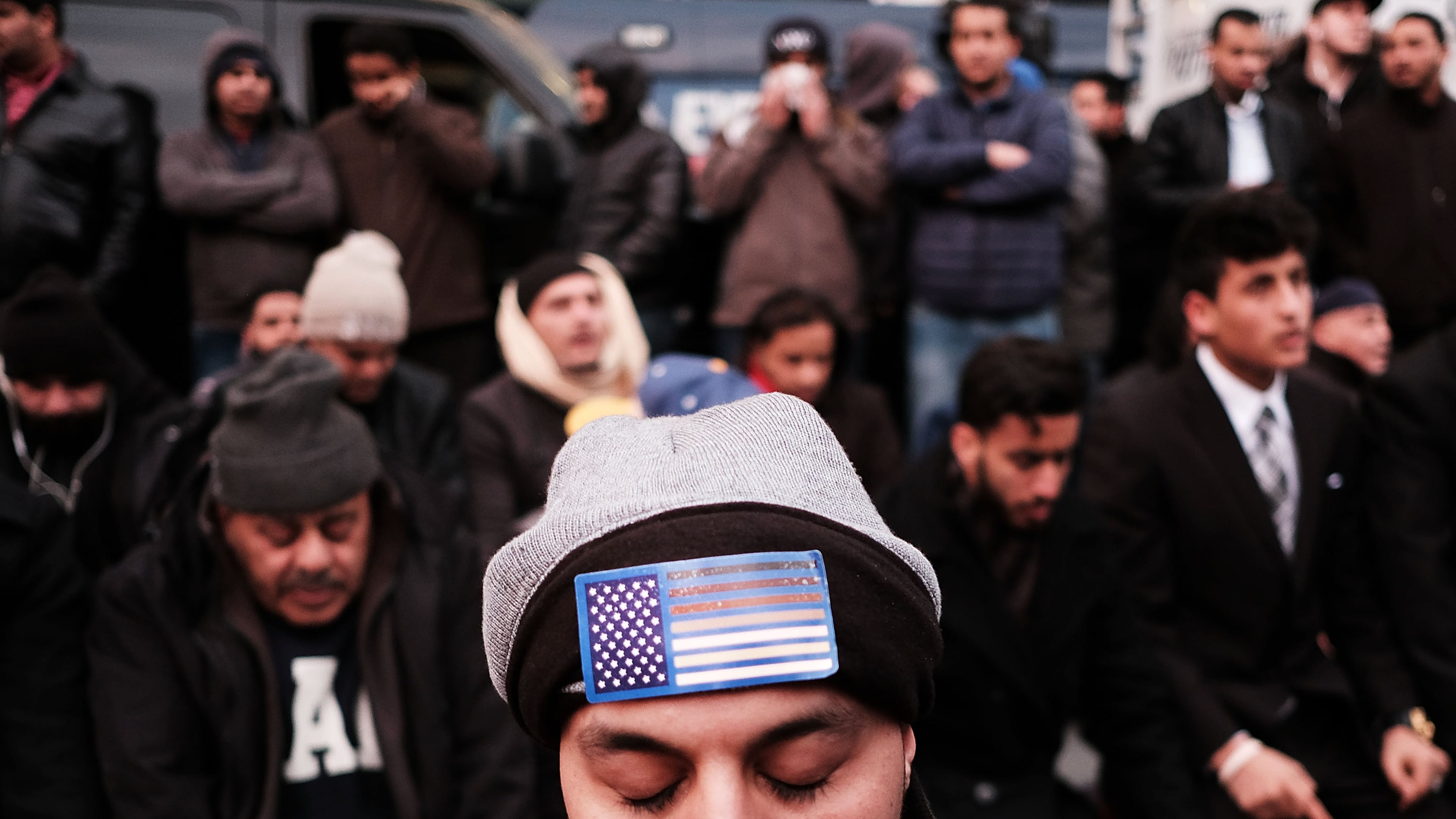 NEW YORK, NY - FEBRUARY 02: Men pray during a protest by ethinic Yemenis and supporters over President Donald Trump's executive order temporarily banning immigrants and refugees from seven Muslim-majority countries, including Yemen on February 2, 2017 in the Brooklyn borough of New York City. At least 1,000 Yemeni-owned bodegas and grocery-stores across the city shut down from noon to 8 p.m. today to protest the order. (Photo by Spencer Platt/Getty Images)