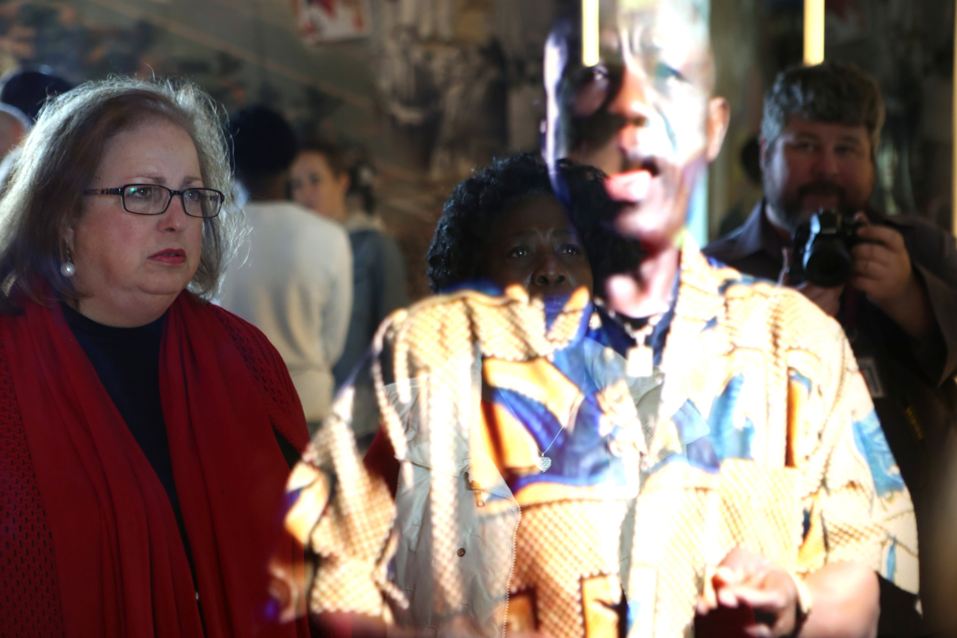 February 14, 2017, Atlanta, Georgia - Gwinnett County Commissioner Lynette Howard (left) and Cassandra Harris (right) watch a video display of one of the many types of people discriminated against throughout the world at the National Center for Civil and Human Rights in Atlanta, Georgia, on Tuesday, February 14, 2017. (HENRY TAYLOR / HENRY.TAYLOR@AJC.COM)