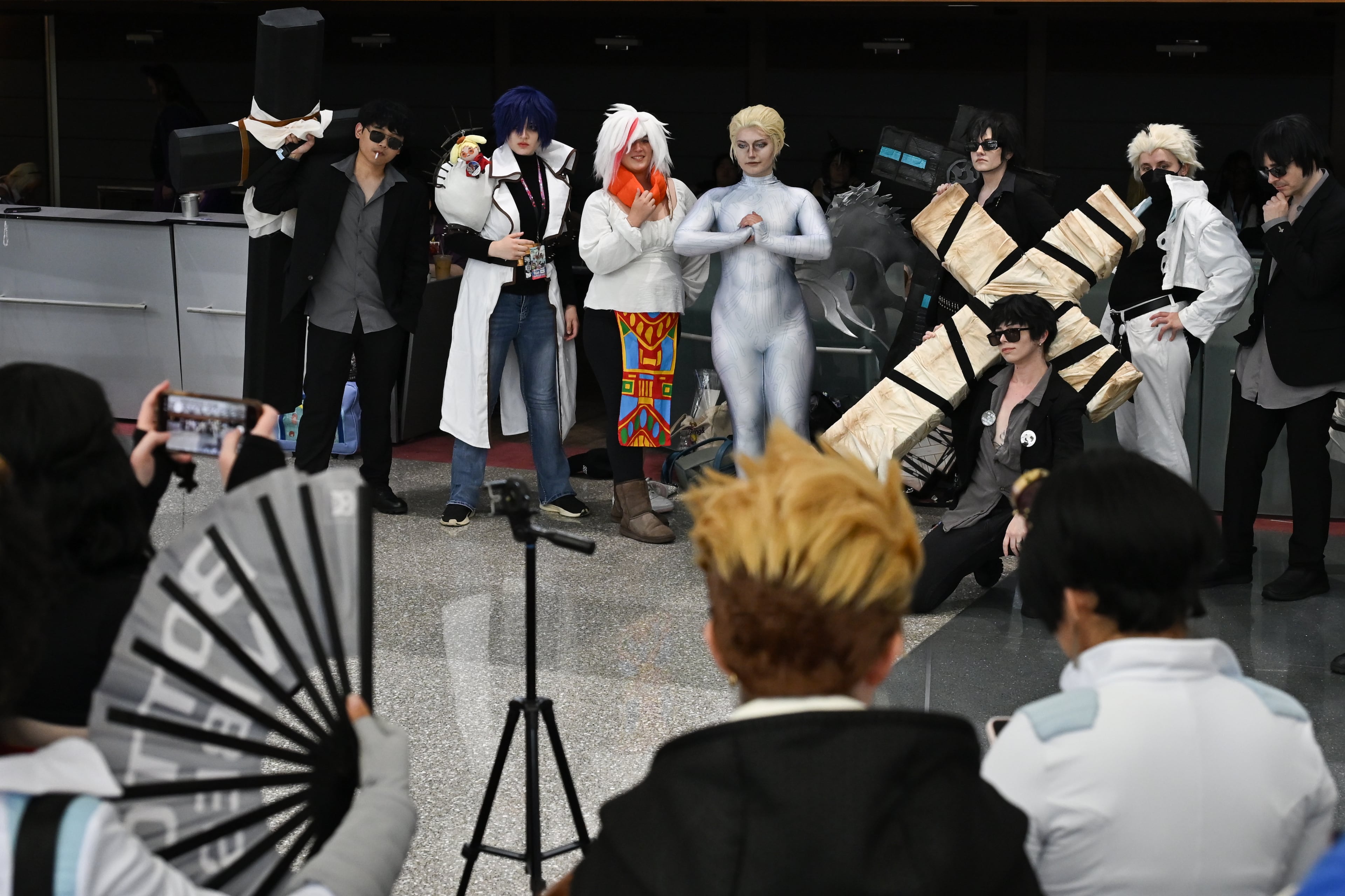 Attendees, dressed as characters from the Japanese manga series "Trigun," pose for a photo during MomoCon at the Georgia World Congress Center in Atlanta on Friday, May 22, 2026. (Tyler Sun for the AJC)