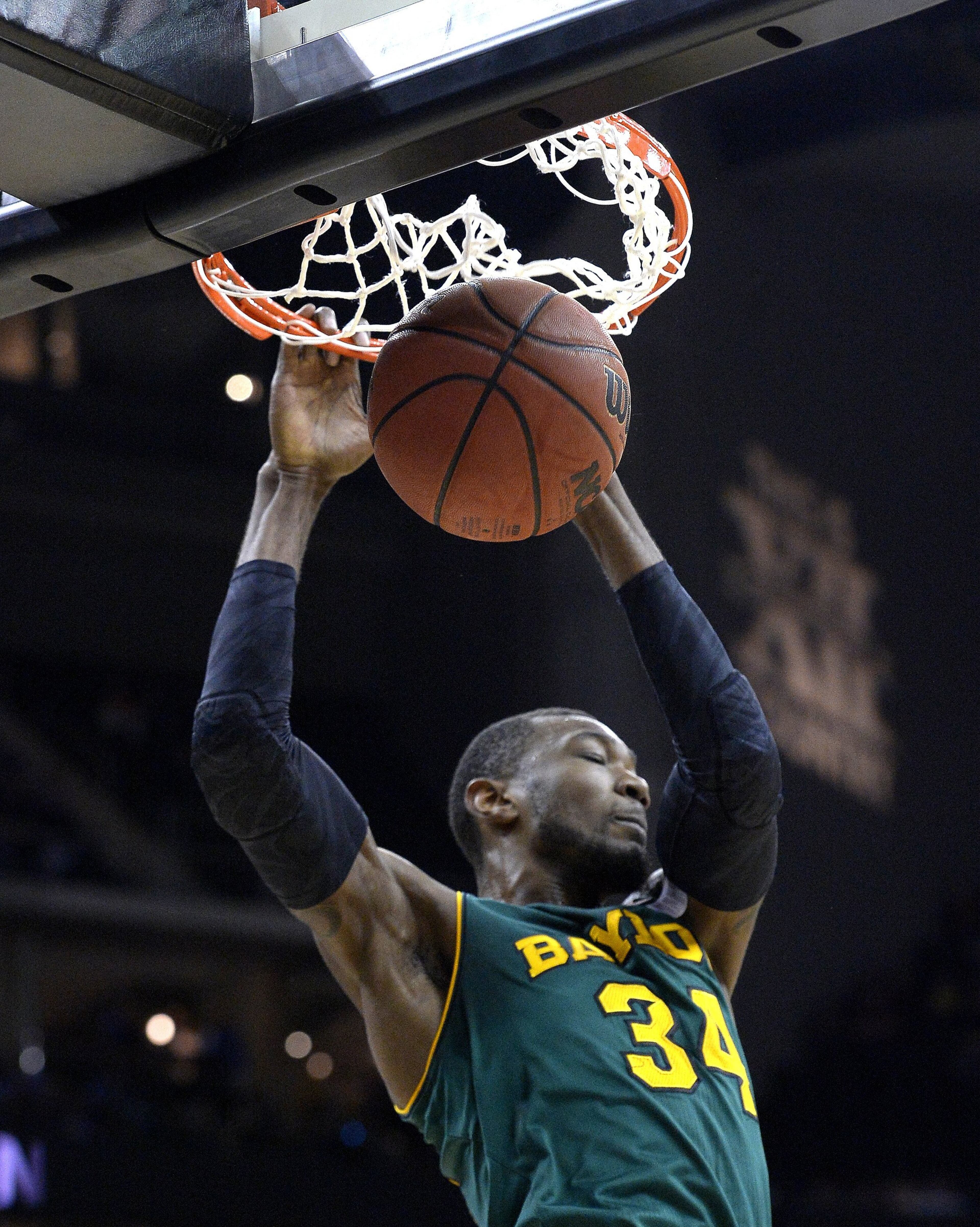 Baylor's Cory Jefferson dunks against Texas during the Big 12 Tournament semifinals at the Sprint Center in Kansas City, Mo., on Friday, March 14, 2014.