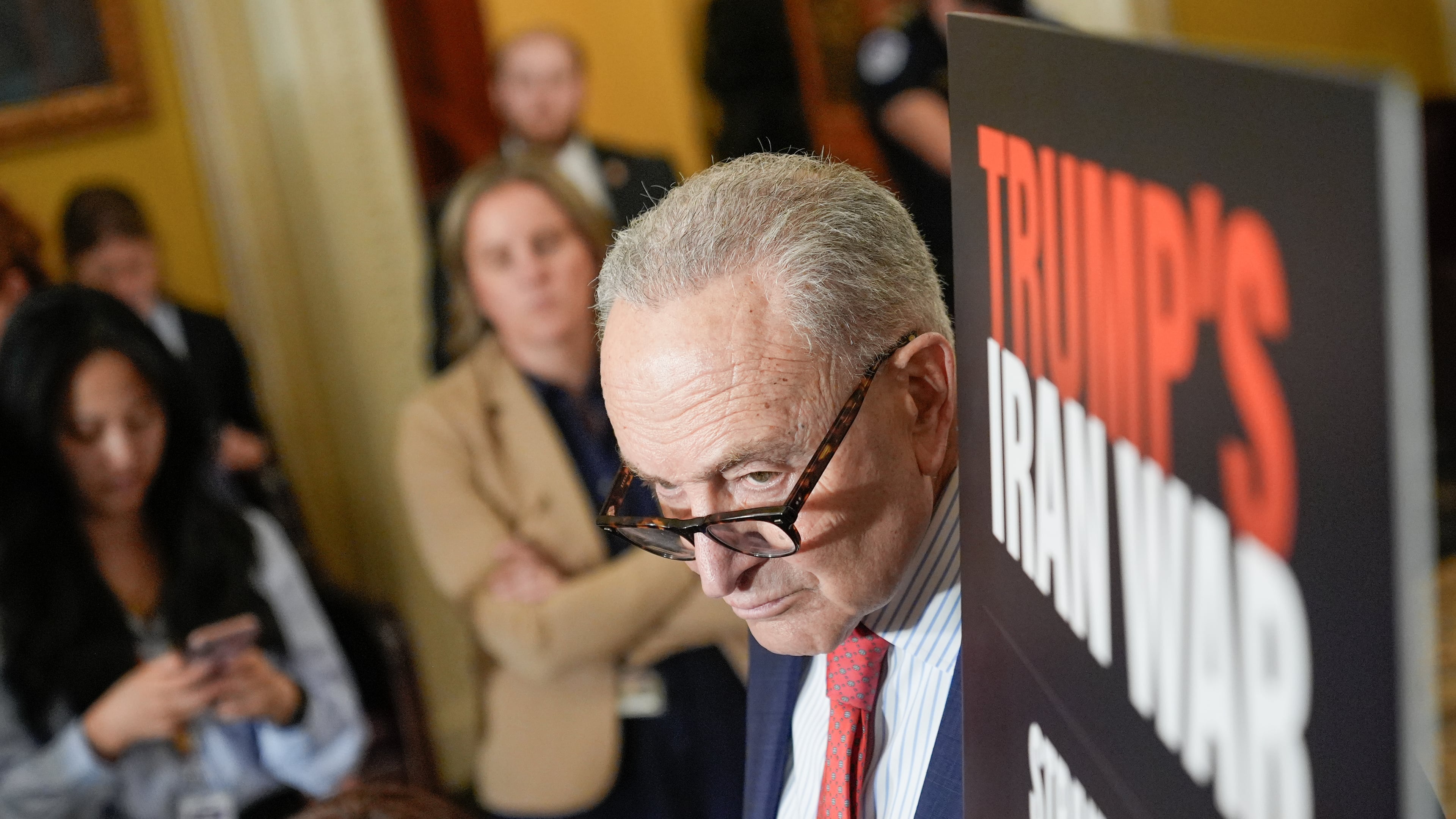 Senate Minority Leader Chuck Schumer, D-N.Y., listens during a news conference after a policy luncheon on Capitol Hill,Tuesday, April 14, 2026, in Washington. (AP Photo/Mariam Zuhaib)