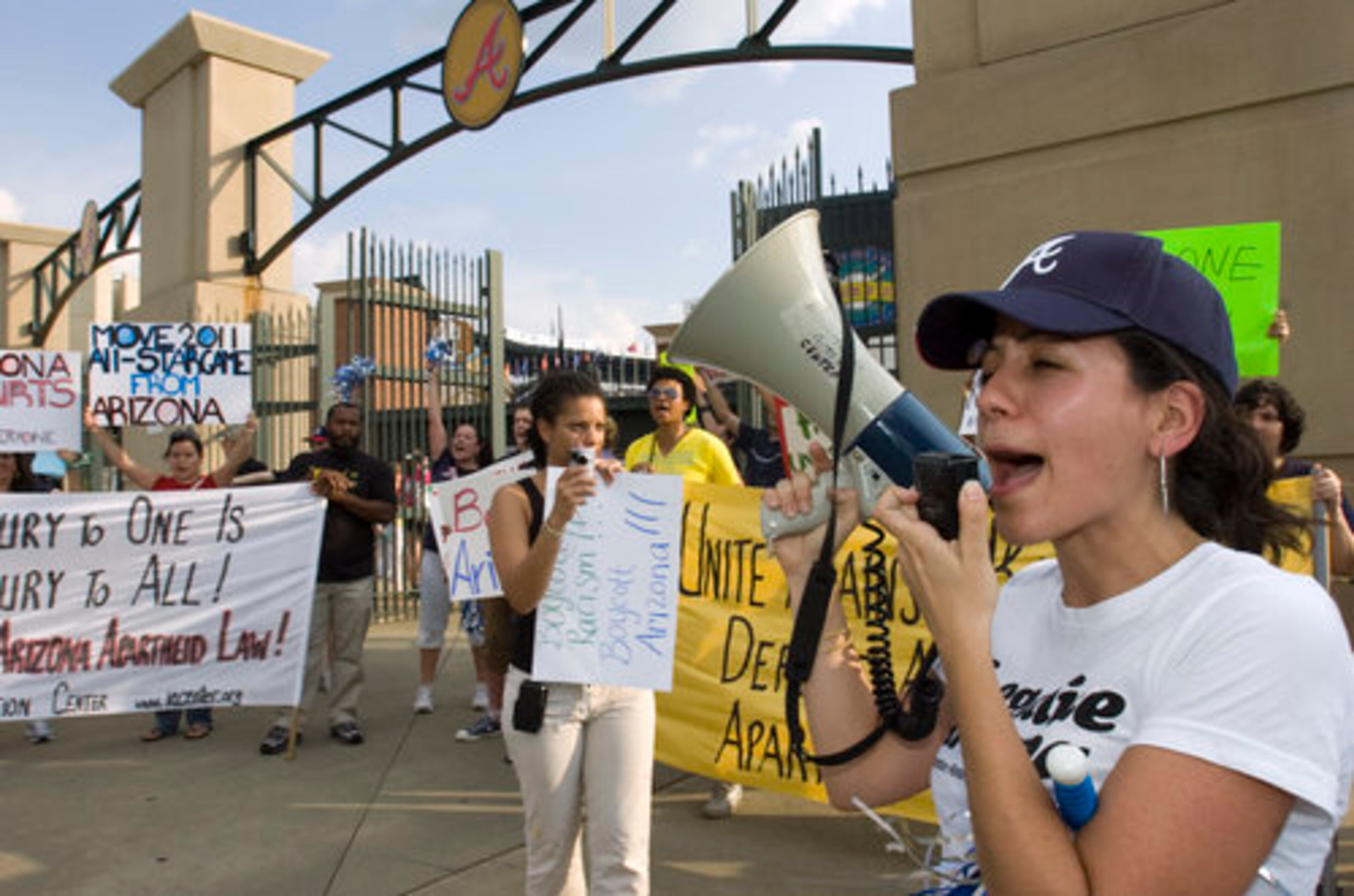 Lisa Adler of Atlanta takes part in the protest. Atlanta is among cities where protesters show up at Arizona Diamondbacks games.