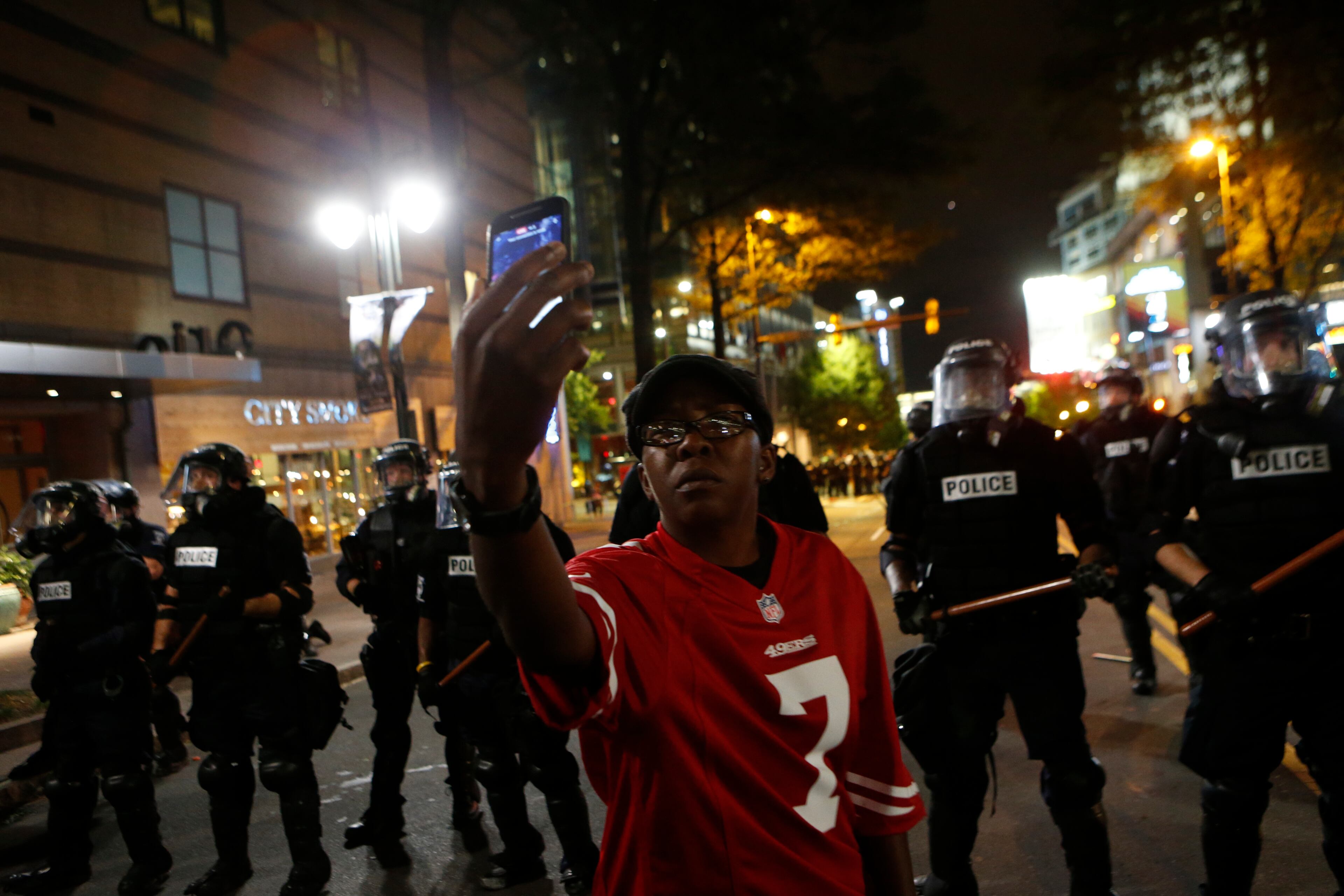 Police clash with protesters as residents and activists protest the death of Keith Scott September 21, 2016 in Charlotte, North Carolina. Scott, who was black, was shot and killed at an apartment complex near UNC Charlotte by police officers, who say they warned Scott to drop a gun he was allegedly holding. (Photo by Brian Blanco/Getty Images)