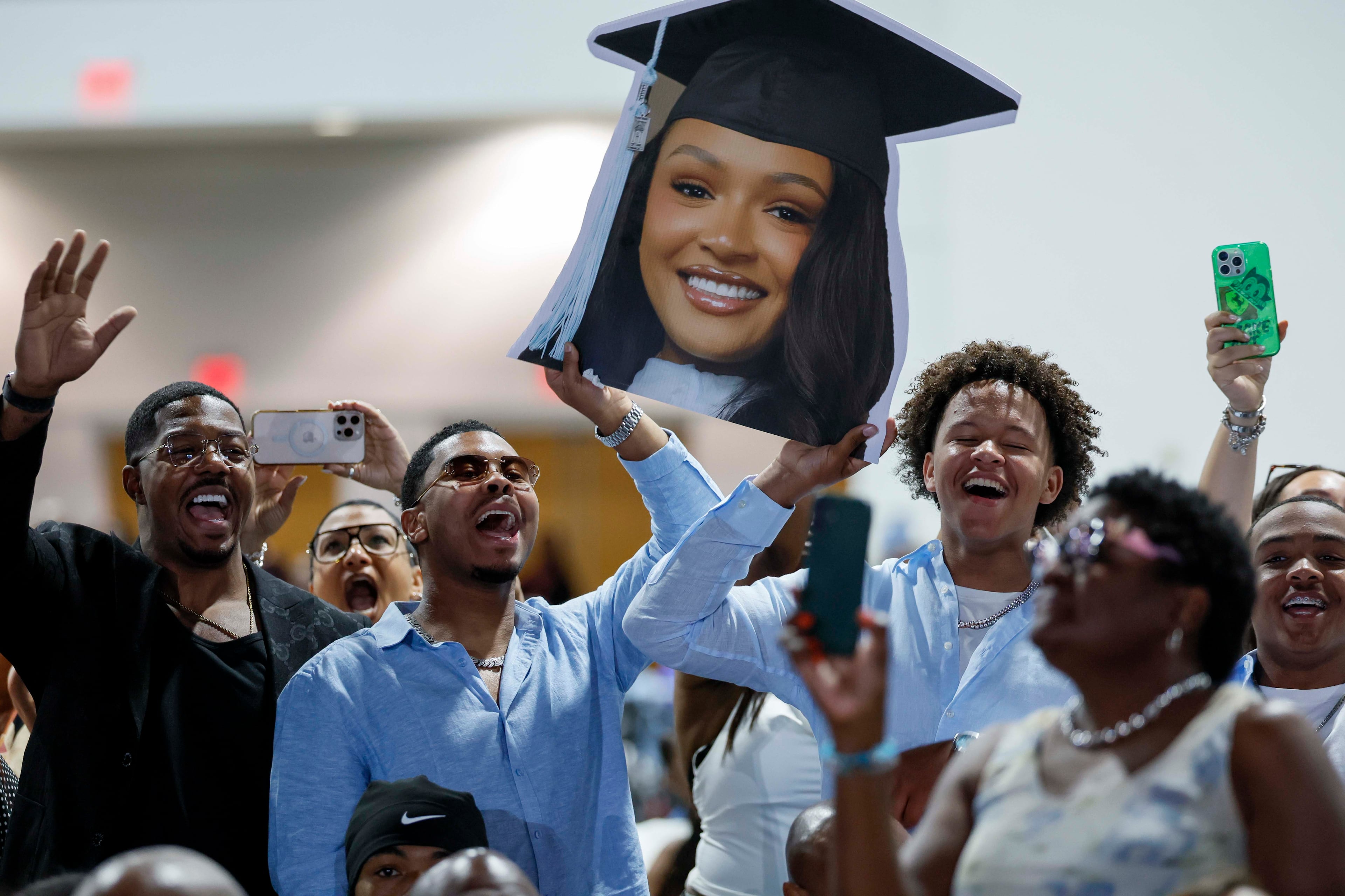 Friends and family cheer for their graduates during the Spelman College Commencement ceremony at the Georgia International Convention Center in College Park on Sunday, May 17, 2026. (Miguel Martinez/AJC)