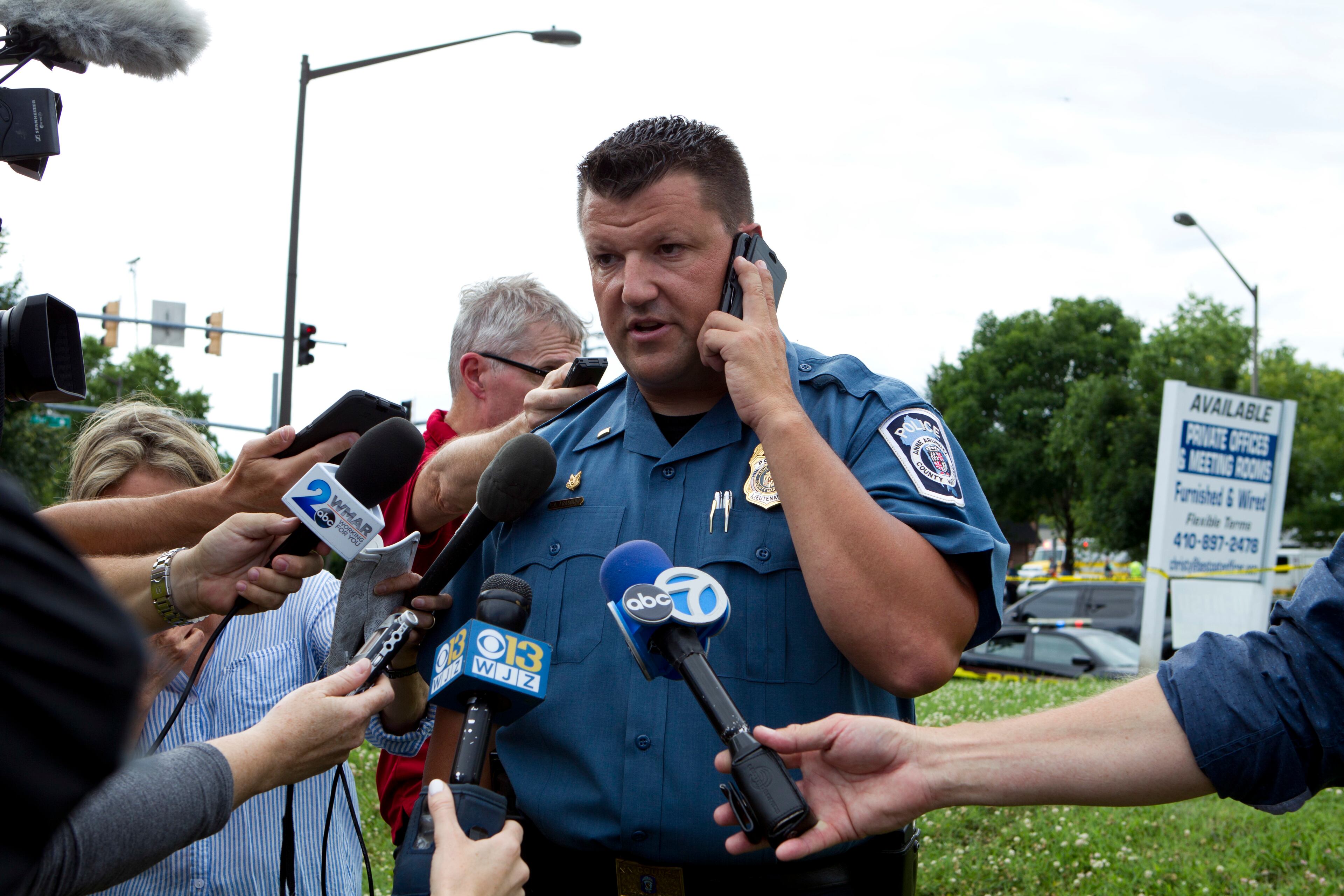 Maryland Police Lt. Ryan Frashure speaks to the media at the scene after multiple people were shot at a newspaper office building in Annapolis, Md., Thursday, June 28, 2018. (AP Photo/Jose Luis Magana)