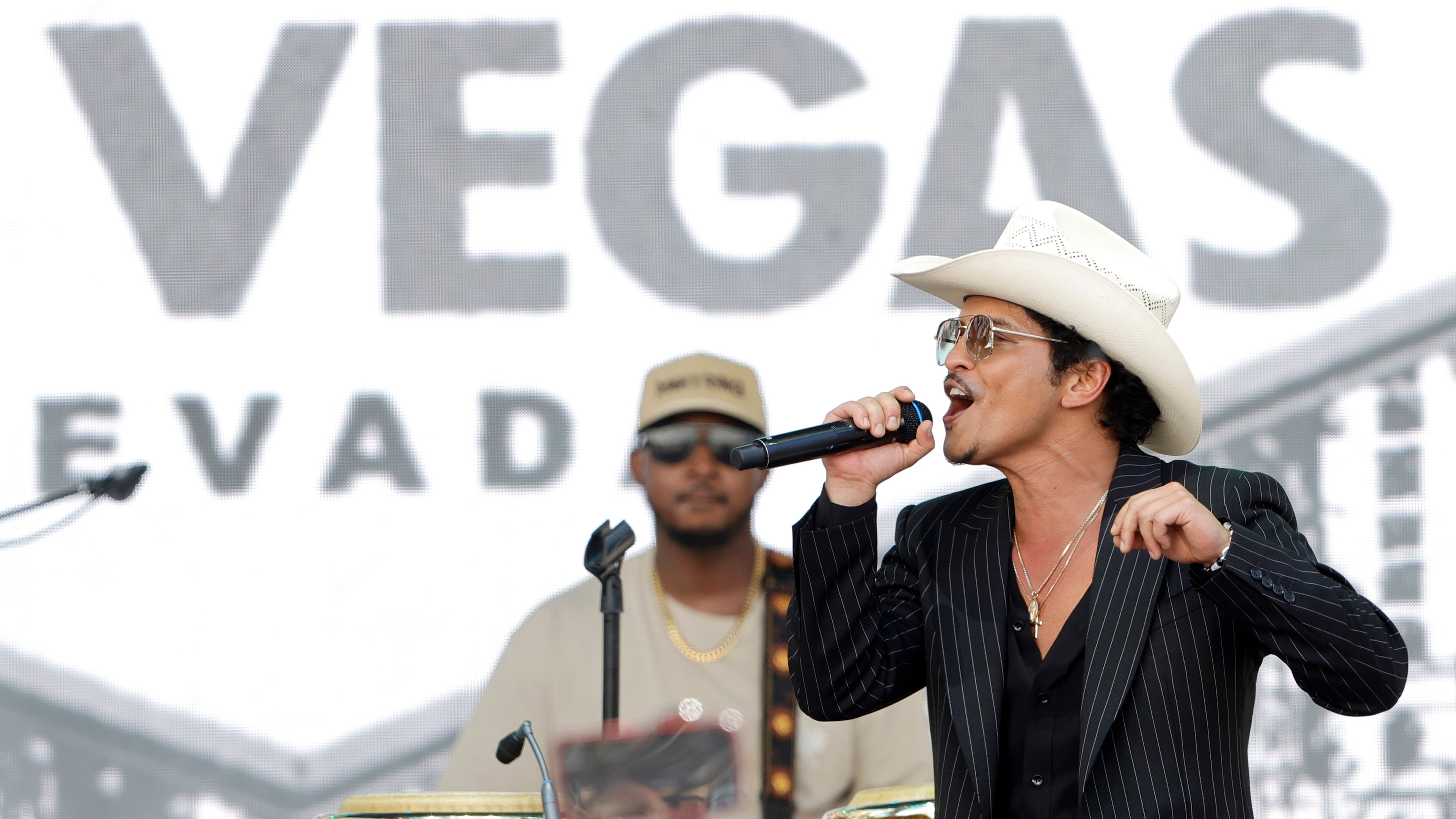 Bruno Mars performs for fans in Toshiba Plaza after a parade down the Las Vegas Strip Friday, April 10, 2026, in Las Vegas, on "Bruno Mars Day." (Steve Marcus/Las Vegas Sun via AP)