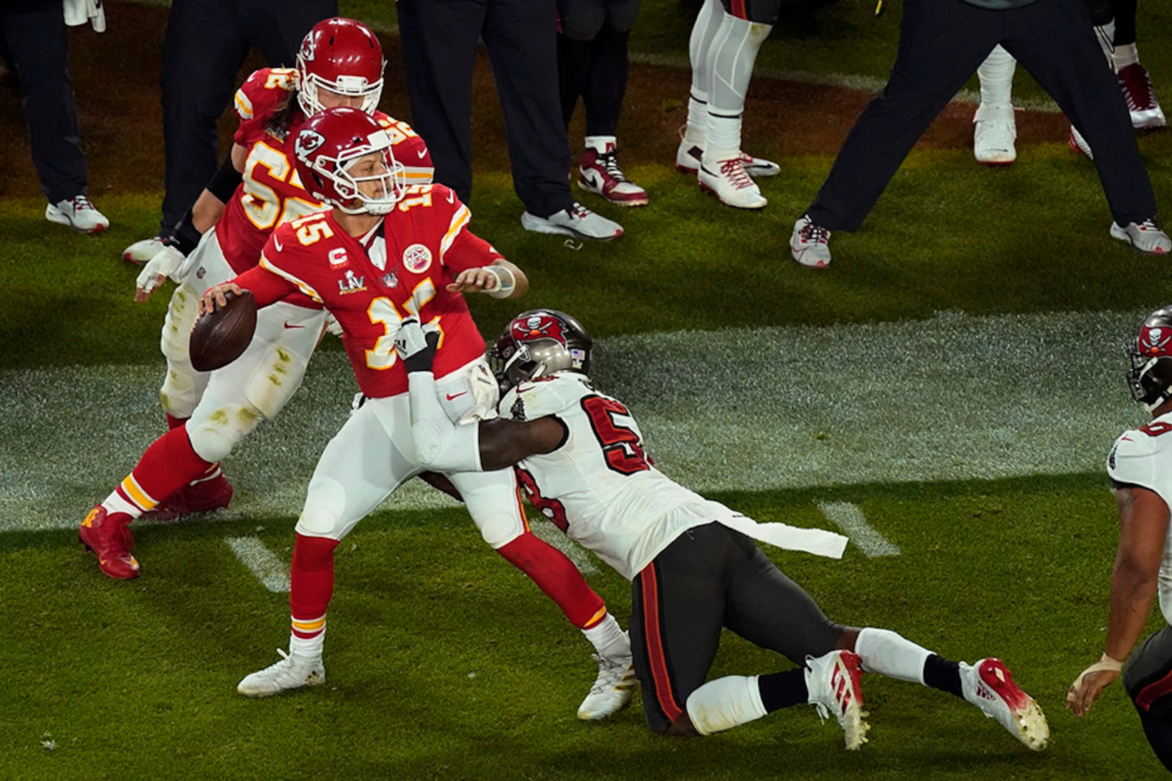 Kansas City Chiefs quarterback Patrick Mahomes (15) is pressured by Tampa Bay Buccaneers' Shaquil Barrett (58) during the second half of Super Bowl 55 Sunday, Feb. 7, 2021, in Tampa, Fla. (Charlie Riedel/AP)