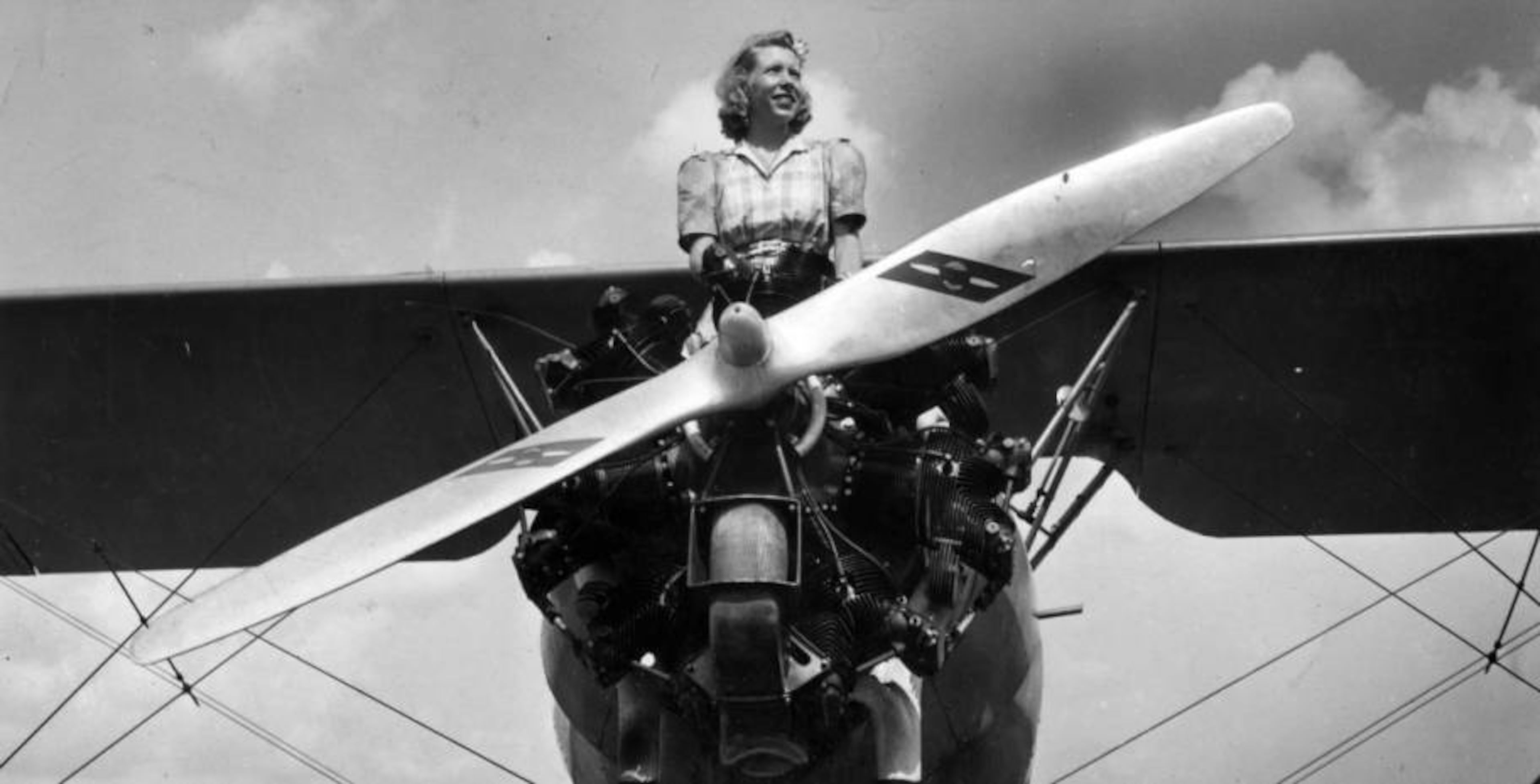 Atlanta socialite and pilot Nell Winship poses on top of a plane in Atlanta in August 1941. AJC file