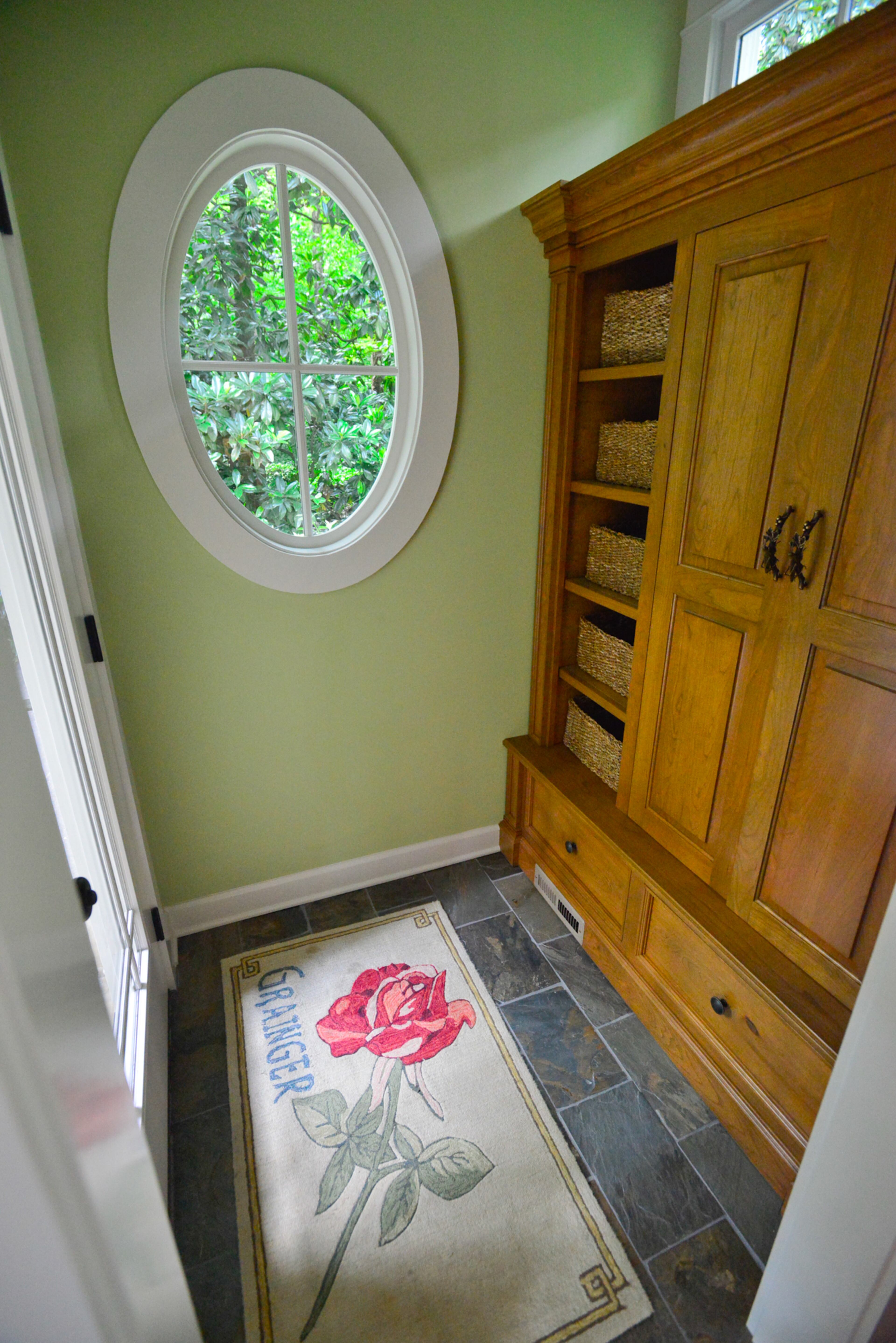 Custom pieces added during the years-long renovations include a cabinet made by Reinhart Furniture of Woodstock for the mudroom, which offers views of the wooded Buckhead lot.