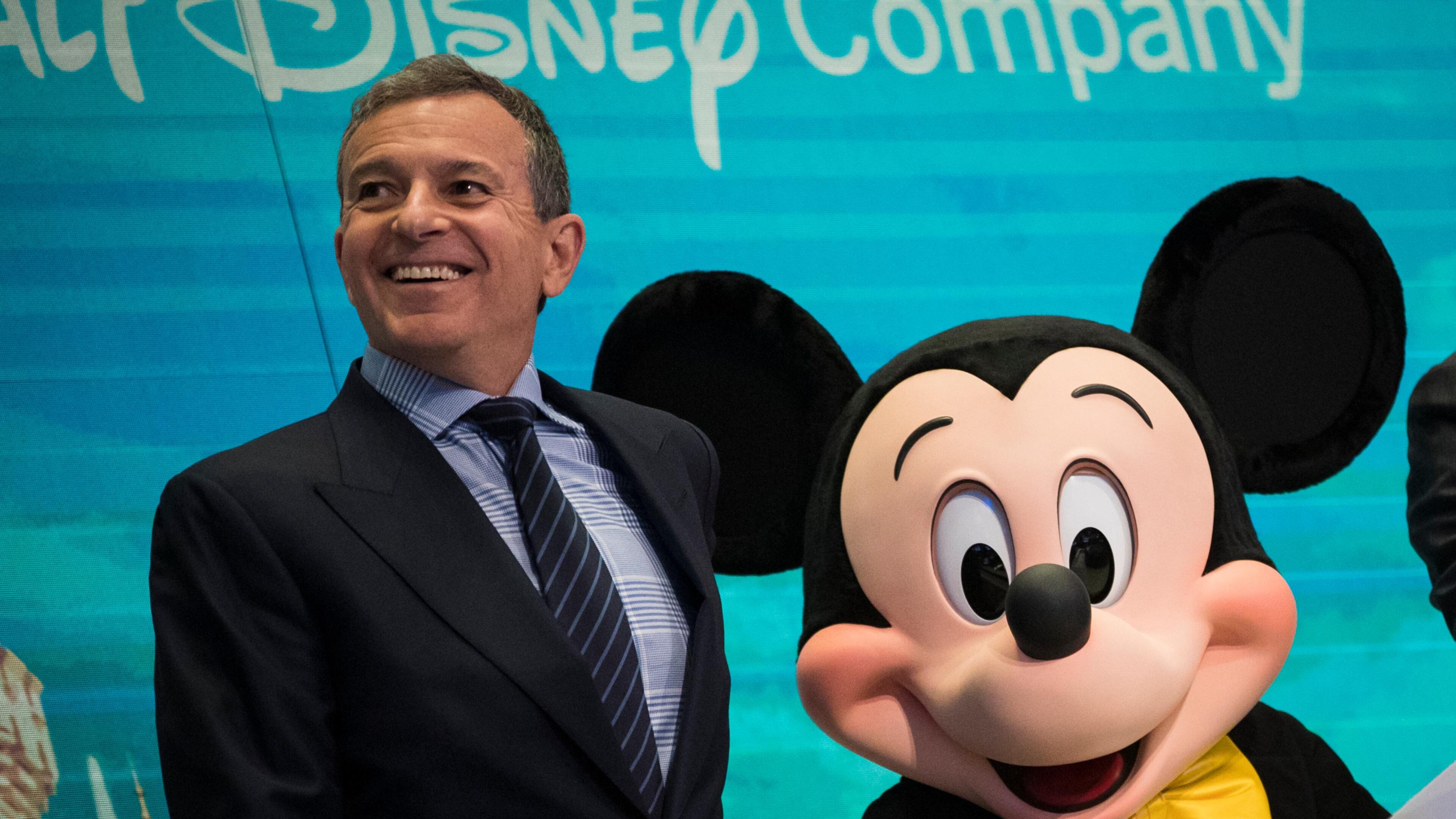 FILE PHOTO: Chief executive officer and chairman of The Walt Disney Company Bob Iger and Mickey Mouse look on before ringing the opening bell at the New York Stock Exchange (NYSE), November 27, 2017 in New York City.