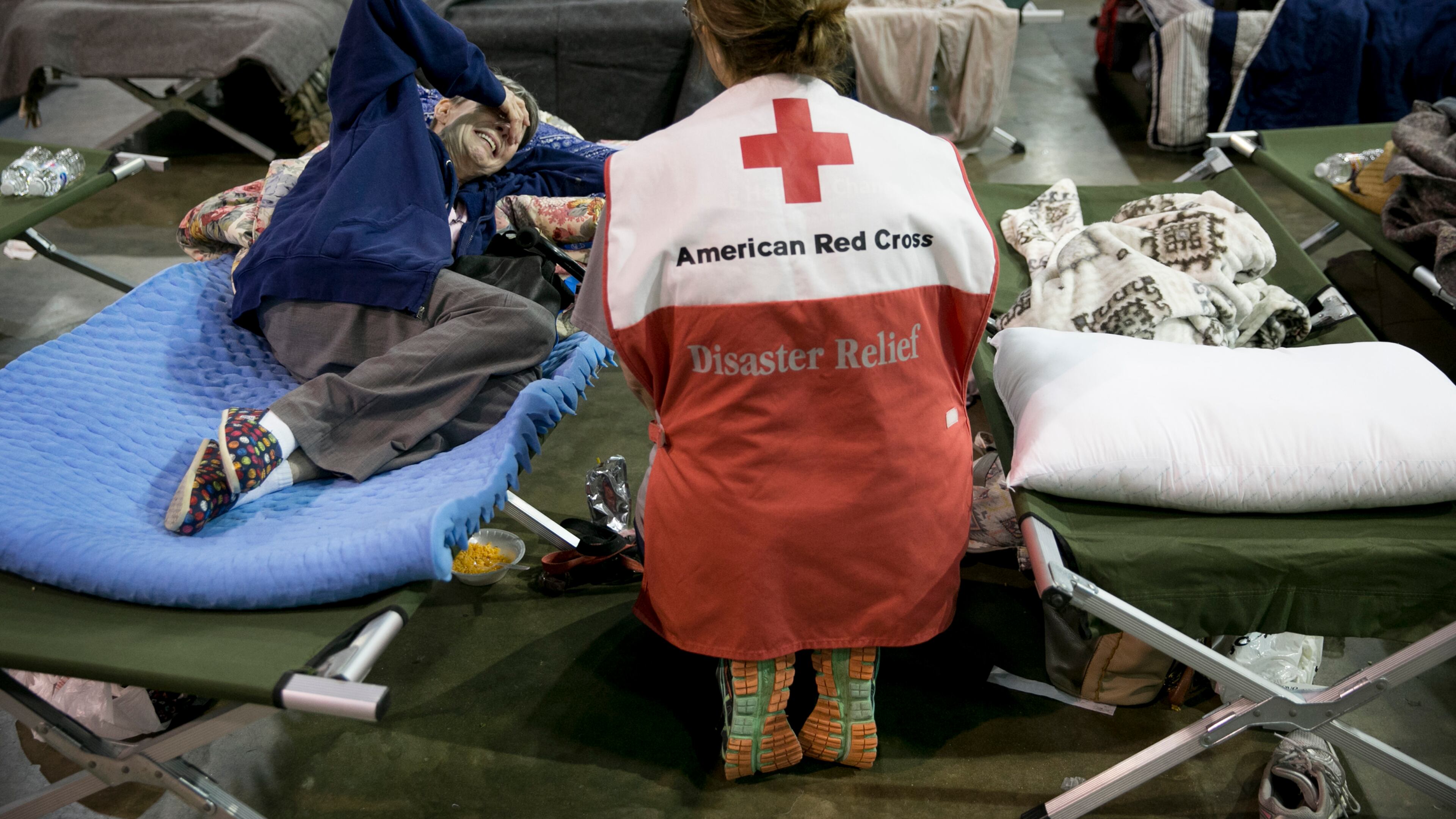 Volunteer Lisa Black comforts Janice Forse at the emergency shelter at the Beaumont Civic Center in Beaumont after Hurricane Harvey on Wednesday August 30, 2017. Her home in Beaumont was flooded Wednesday morning. "Even Katrina wasn't this bad," she said.