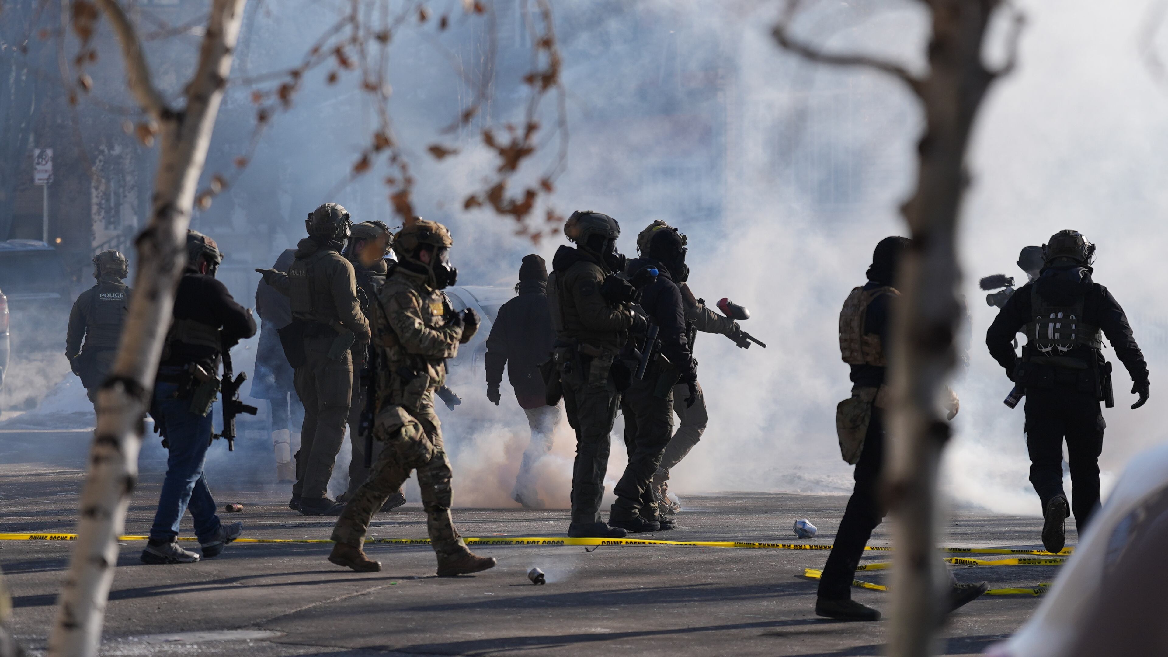 FILE - Federal immigration officers deploy tear gas at protesters after a shooting Jan. 24, 2026, in Minneapolis. (AP Photo/Abbie Parr, File)