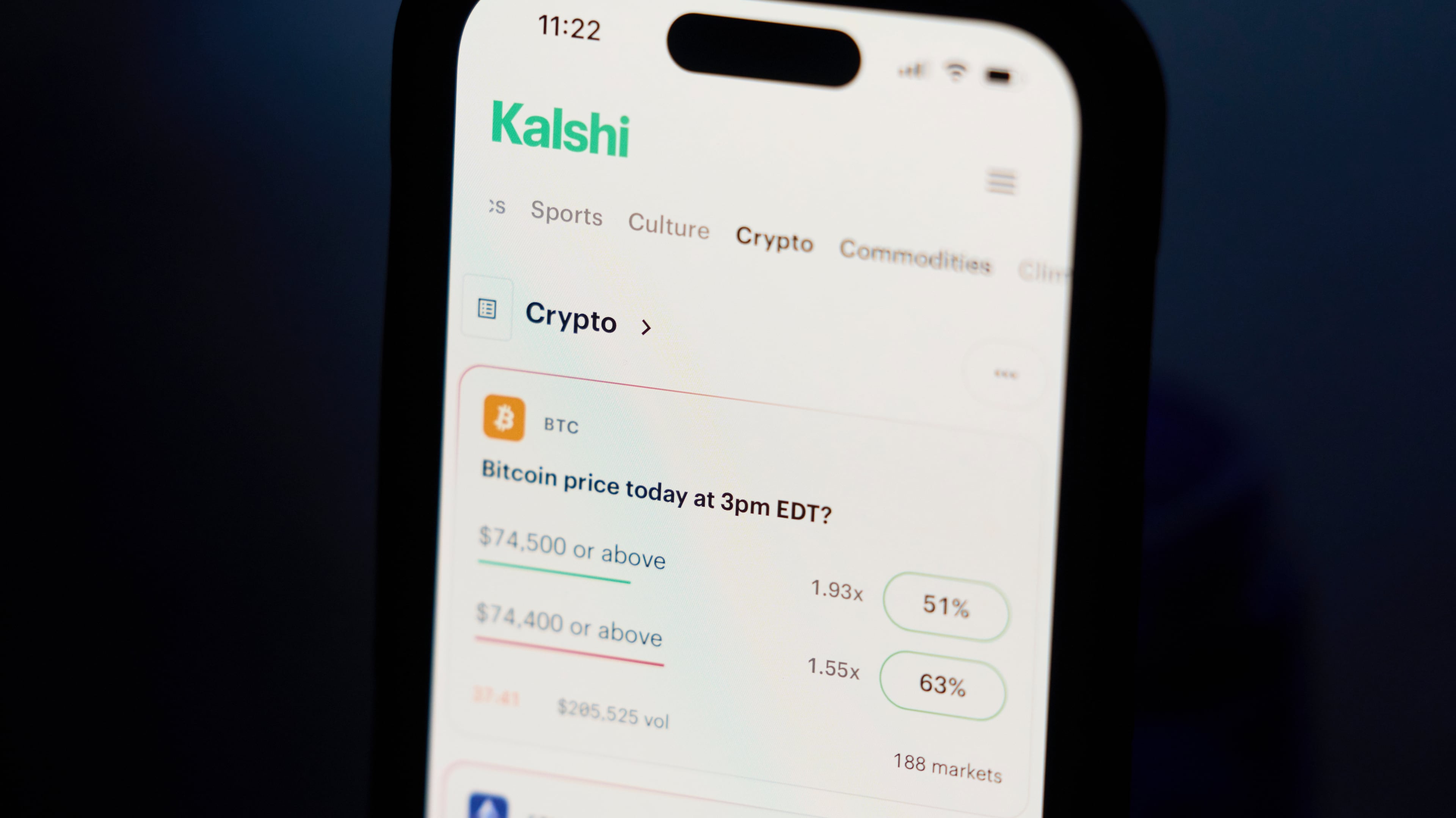 FILE - A phone displays crypto prices on the Kalshi app on April 16, 2026, in Portland, Ore. (AP Photo/Jenny Kane, File)