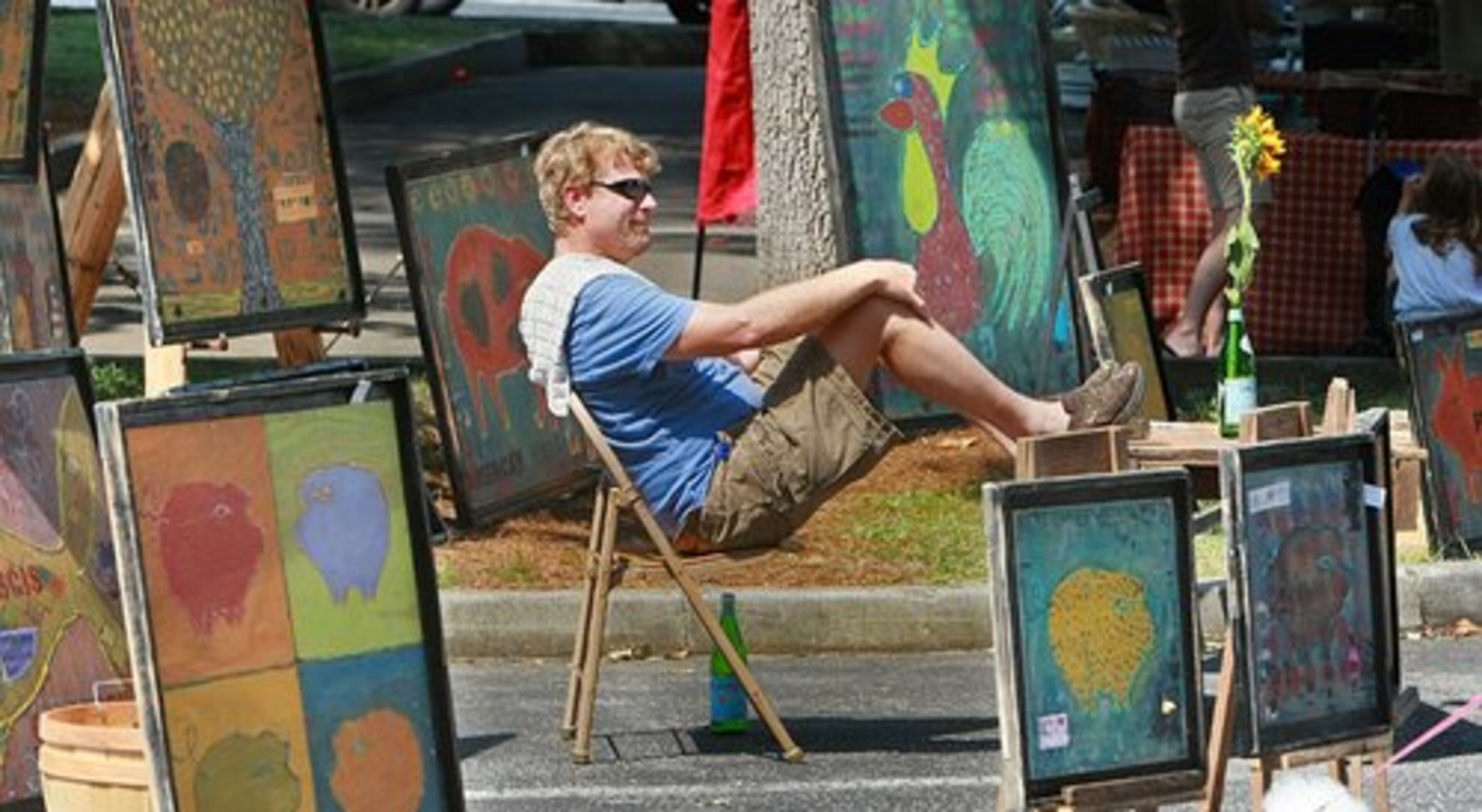 Tracy Hartley of East Point shows his art Saturday, Hartley is a self-taught artist who uses mixed media and farm themes.