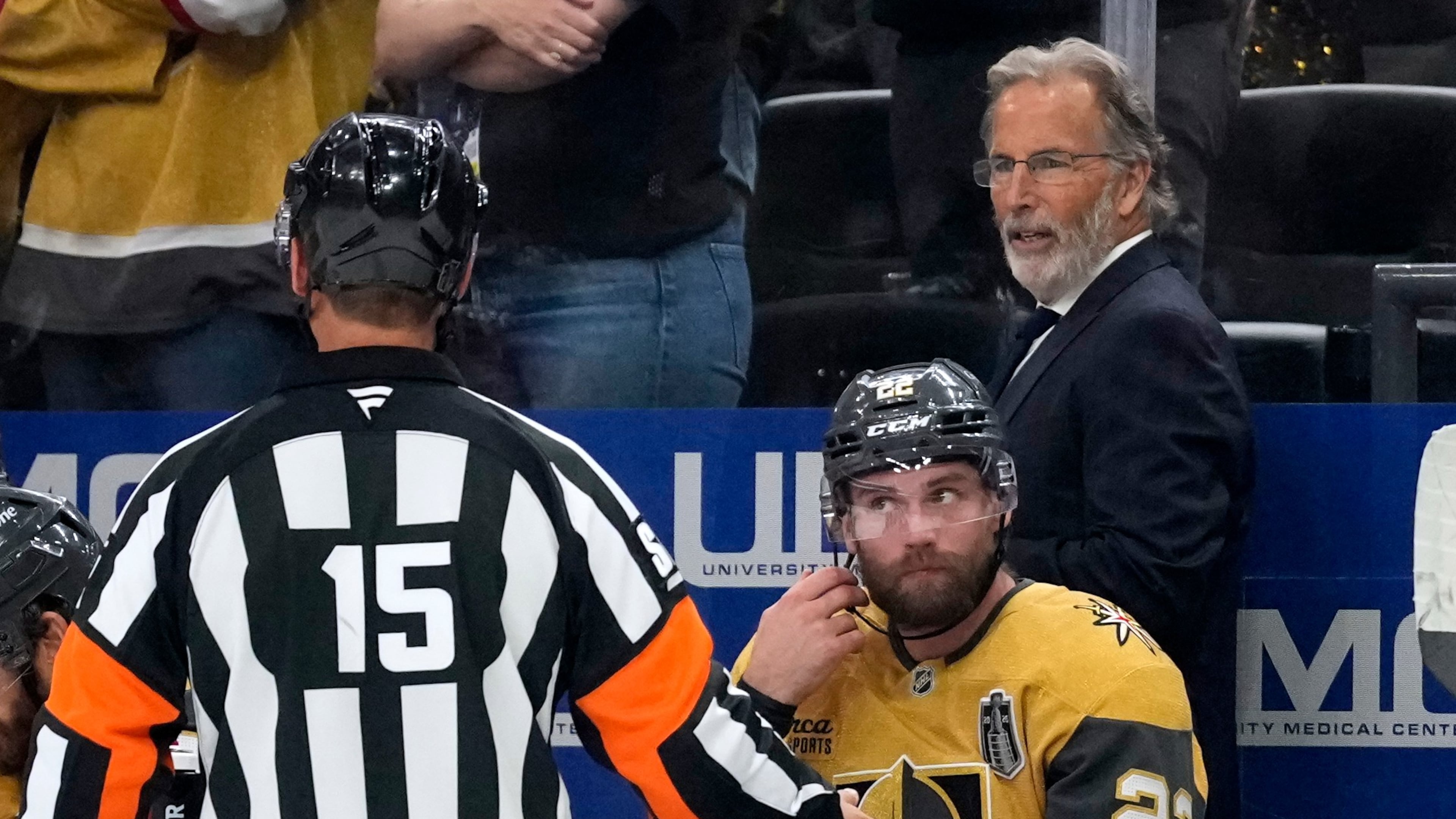Vegas Golden Knights head coach John Tortorella, right, talks to a referee during the third period in Game 4 of the NHL hockey Stanley Cup Final series against the Carolina Hurricanes, Tuesday, June 9, 2026, in Las Vegas. (AP Photo/John Locher)