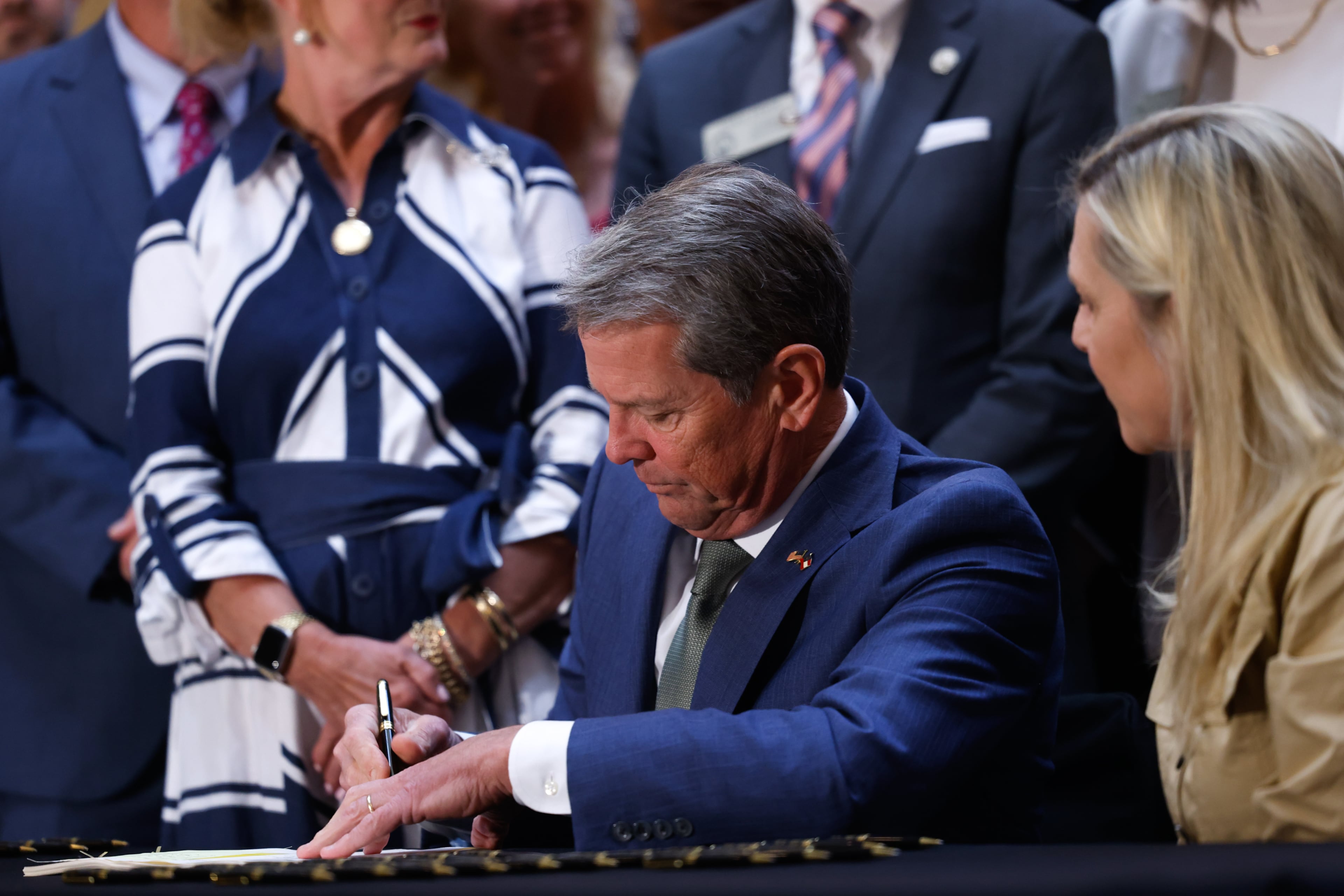 Gov. Brian Kemp signed a series of education bills on Tuesday. (Arvin Temkar/AJC)