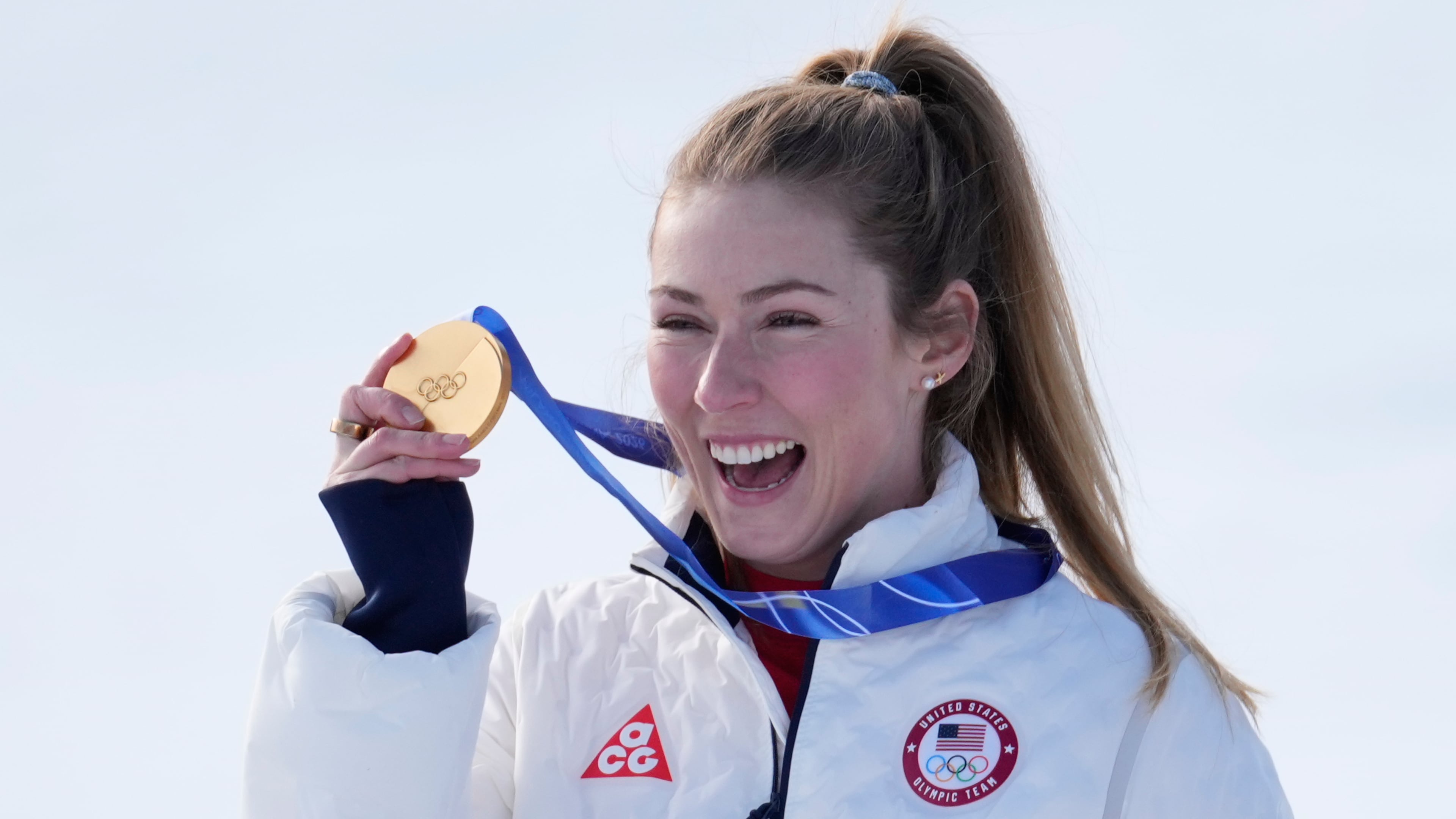 United States' Mikaela Shiffrin shows her gold medal of the alpine ski, women's slalom race, at the 2026 Winter Olympics, in Cortina d'Ampezzo, Italy, Wednesday, Feb. 18, 2026. (AP Photo/Robert F. Bukaty)