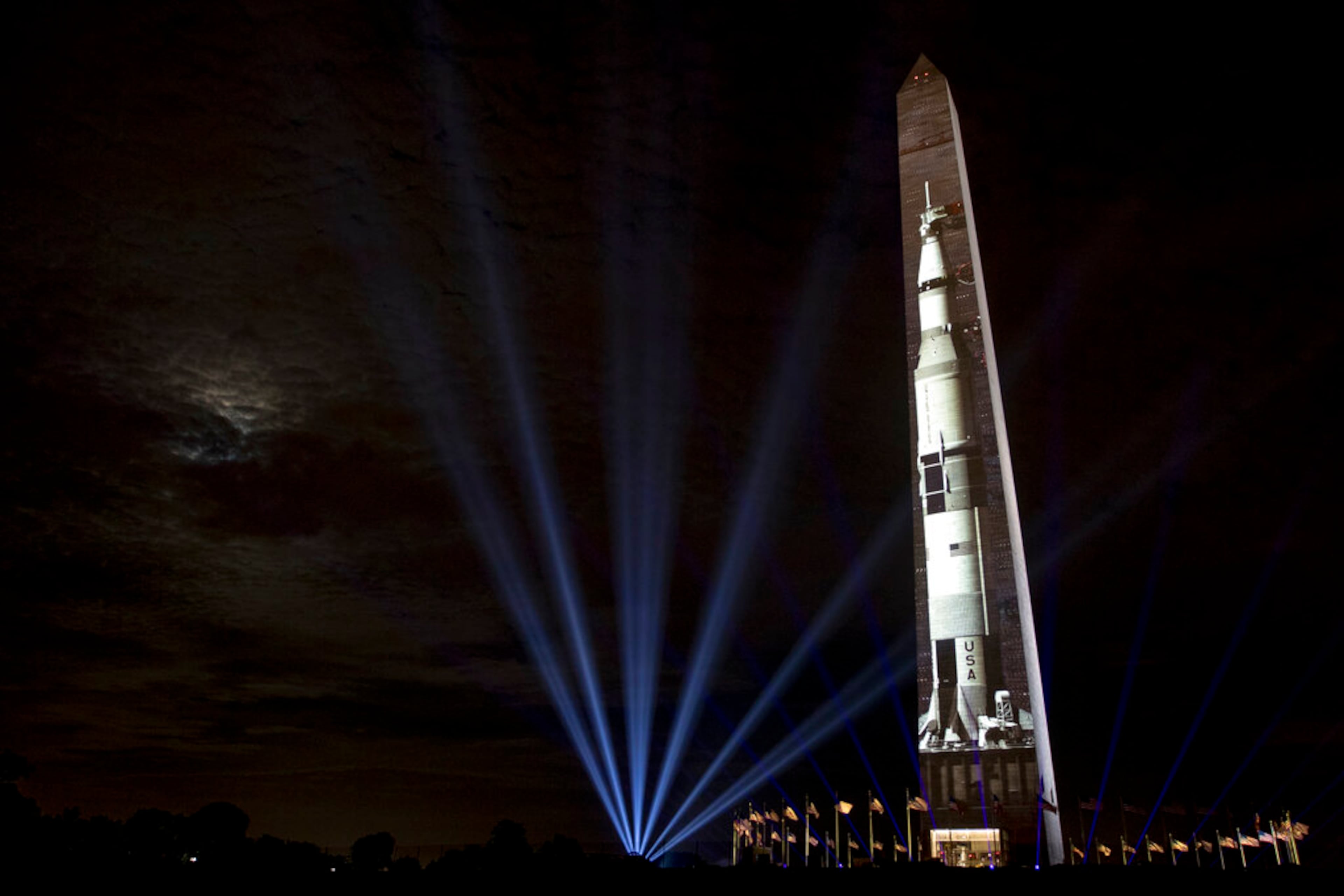 The image of a 363-foot Saturn V rocket is projected on the east face of the Washington Monument in Washington, Wednesday, July 17, 2019, in celebration of the 50th anniversary of the Apollo 11 moon landing. (AP Photo/Andrew Harnik)