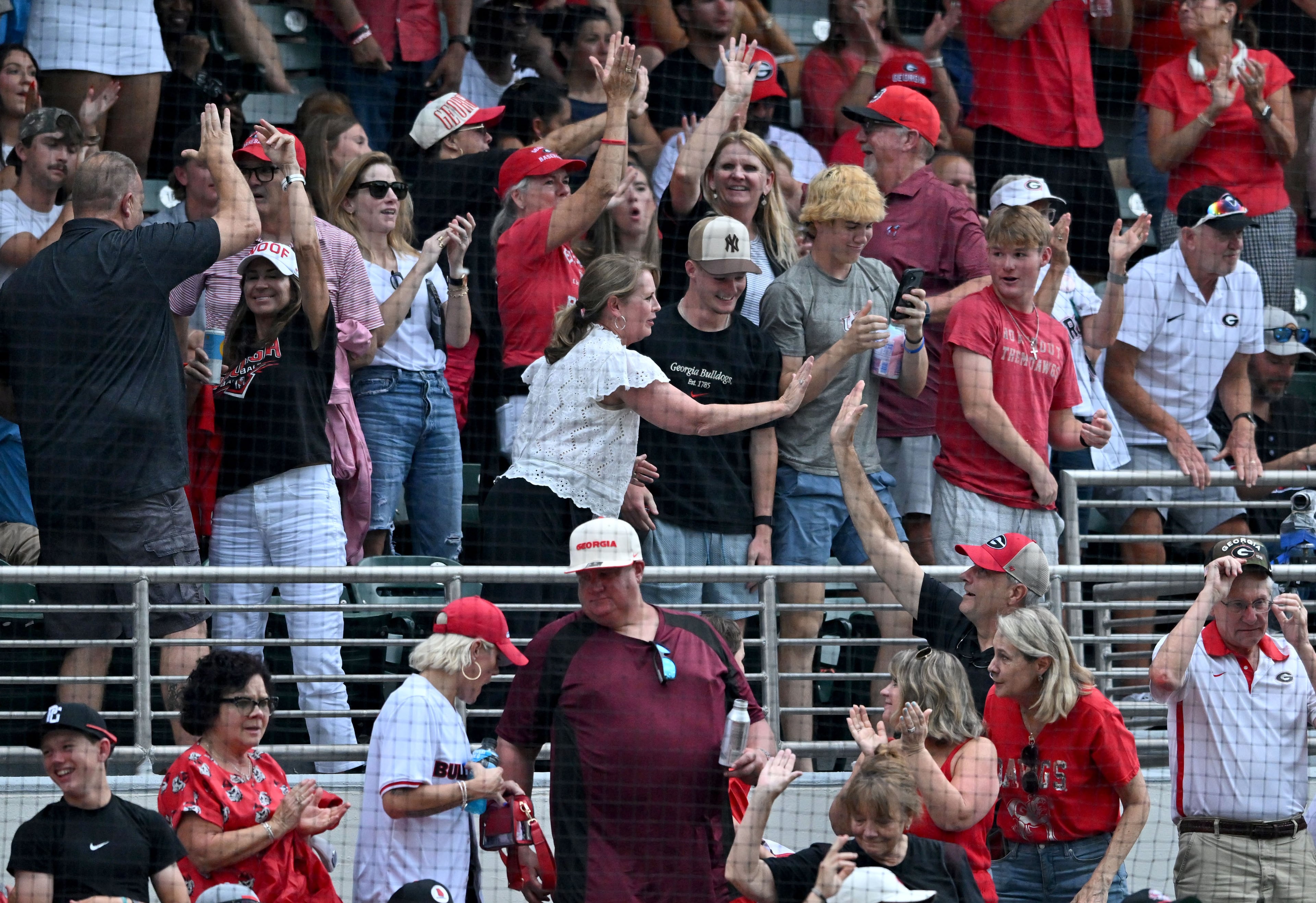Georgia fans cheer as infielder Ryan Black hits a solo home run during the fifth inning of their NCAA Regional game at Foley Field, Friday, May 29, 2026, in Athens. (Hyosub Shin/AJC)