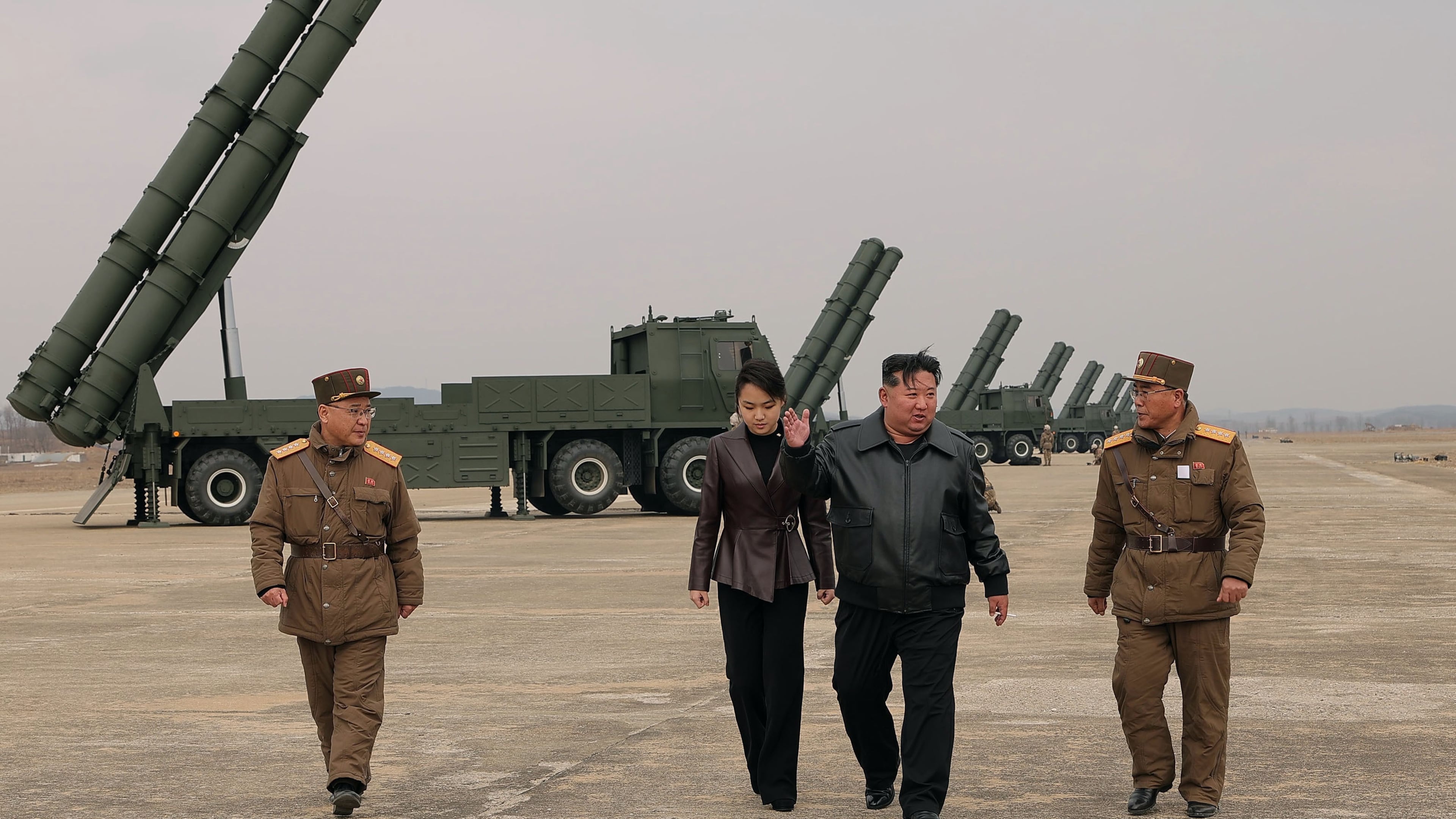 In this photo provided by the North Korean government, its leader Kim Jong Un, center right, and his daughter, center left, attend a live-fire test of multiple rocket launch systems, at an undisclosed place in North Korea Saturday, March 14, 2026. Independent journalists were not given access to cover the event depicted in this image distributed by the North Korean government. The content of this image is as provided and cannot be independently verified. Korean language watermark on image as provided by source reads: "KCNA" which is the abbreviation for Korean Central News Agency. (Korean Central News Agency/Korea News Service via AP)