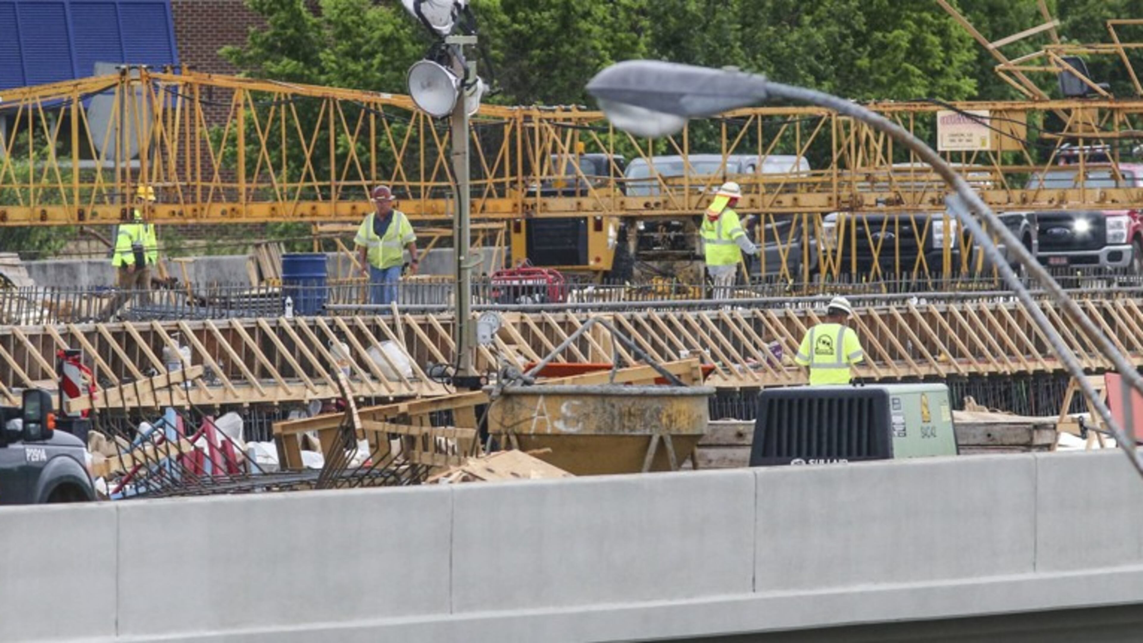 Work continued May 1 on the new I-85 bridge in Buckhead. Since a fire led to the collapse of a segment of I-85 in Buckhead on March 30, the Georgia Department of Transportation has scrambled to reopen the vital stretch of highway into the heart of Atlanta. Contractor C.W. Matthews is rebuilding 350 feet of northbound and 350 feet of southbound lanes on I-85. JOHN SPINK/JSPINK@AJC.COM
