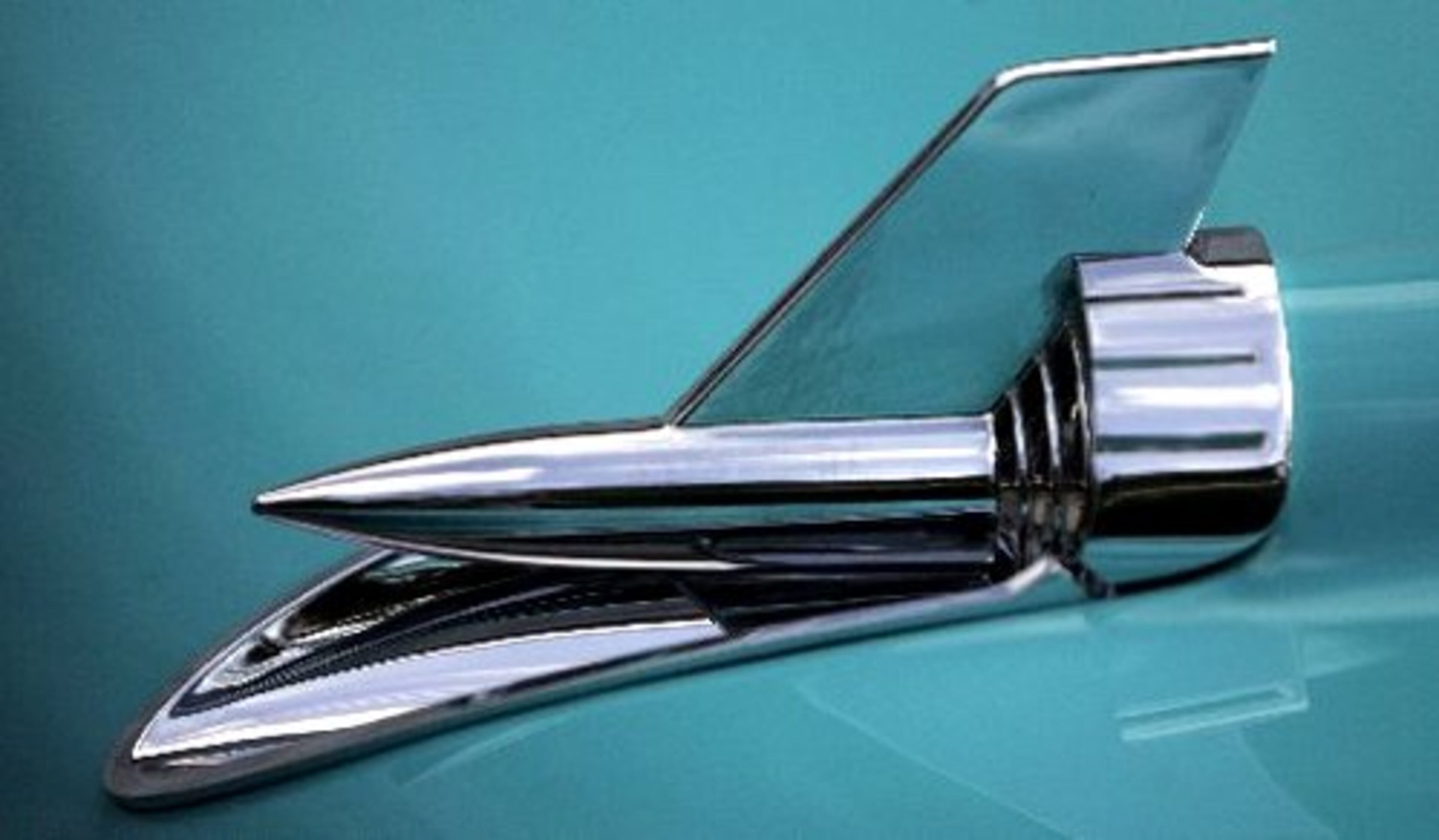 This is the 50th anniversary of the 57 Chevy. This is a 1957 Bel Air Convertible with 283 cu. in. Power Pac 4 barrel Automatic in Tropical Turquoise, offered by Fraser Dante Limited, a Roswell dealership primarily involved with classic cars, for $84,950. In the car is Tevie Dante Fraser, who owns the dealership with Thomas Fraser.