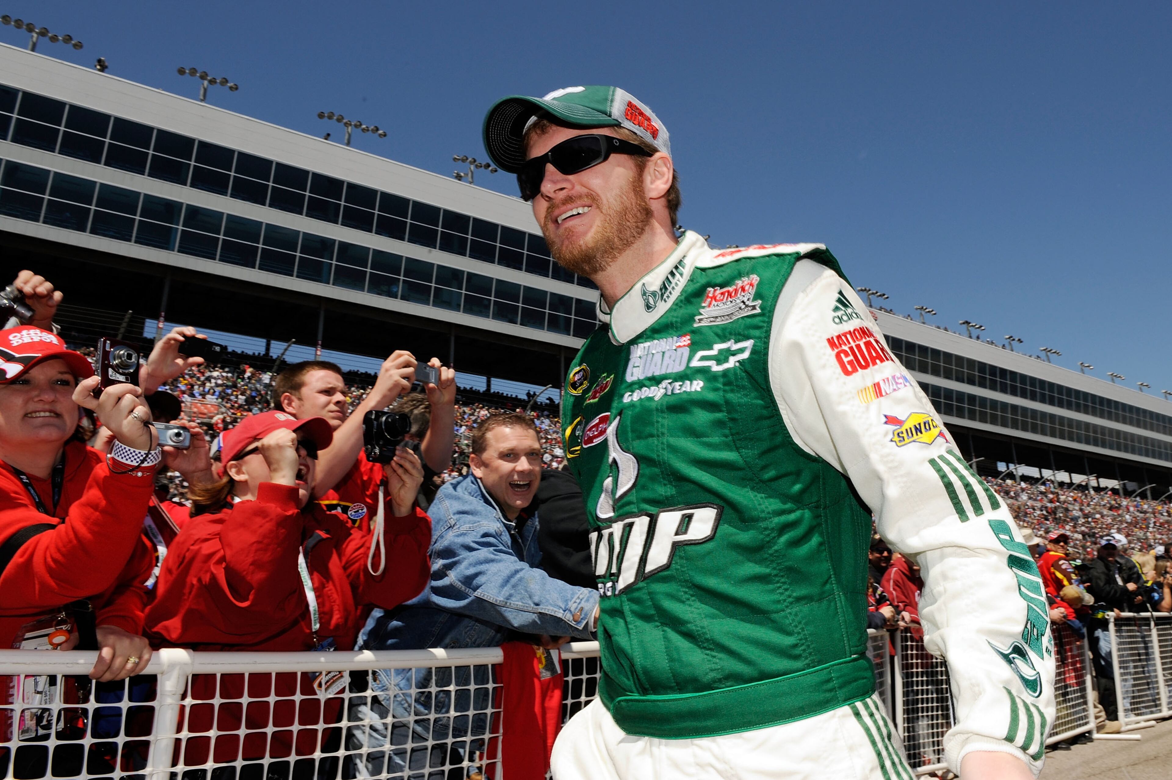 FORT WORTH, TX - APRIL 05: Dale Earnhardt Jr., driver of the #88 National Guard/AMP Energy Chevrolet, shakes hands with fans during driver intros for the NASCAR Sprint Cup Series Samsung 500 at Texas Motor Speedway on April 5, 2009 in Fort Worth, Texas. (Photo by Rusty Jarrett/Getty Images for NASCAR)