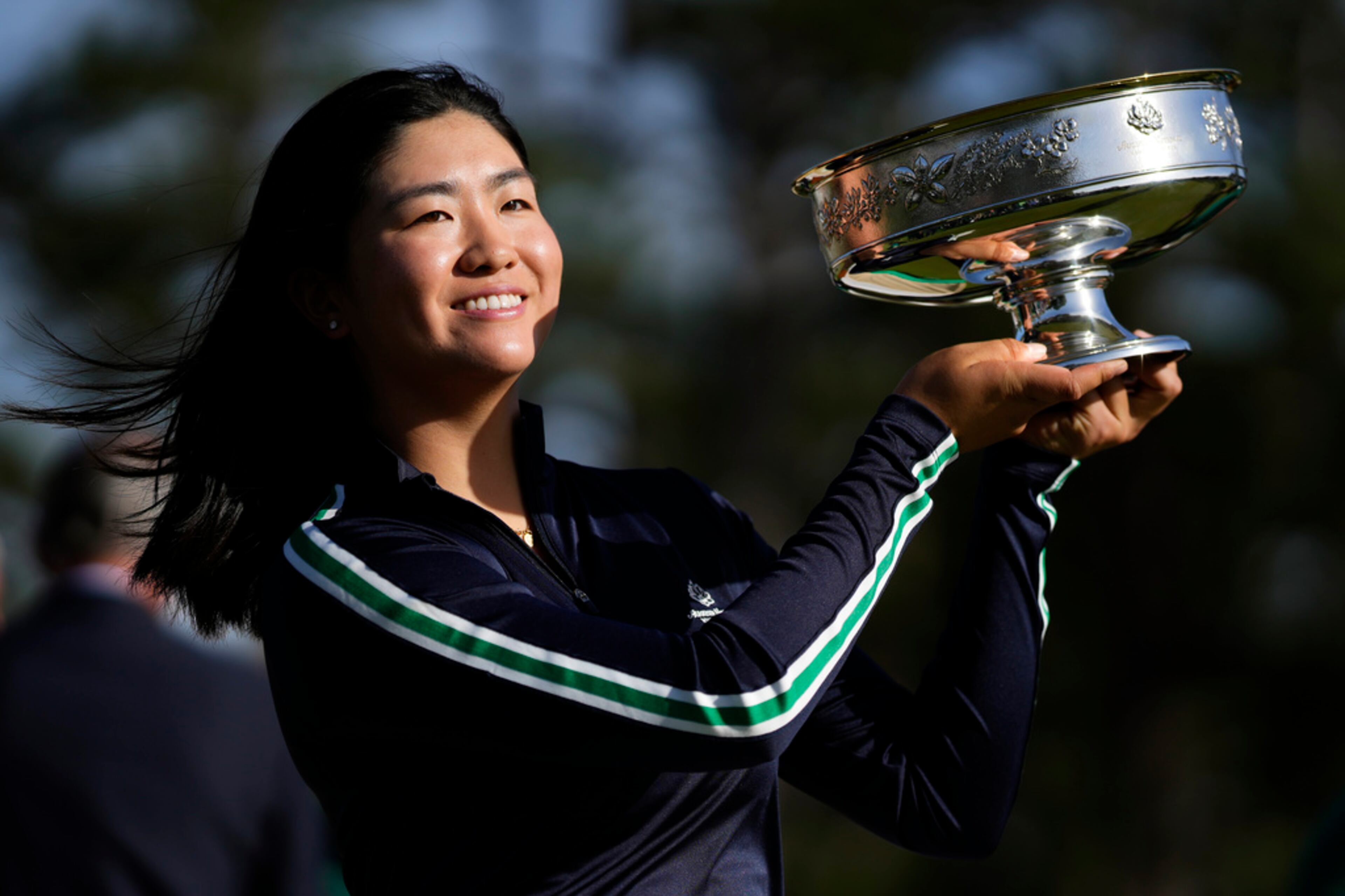 Rose Zhang poses with the trophy after winning the Augusta National Women's Amateur golf tournament, Saturday, April 1, 2023, in Augusta, Ga. (AP Photo/Matt Slocum)