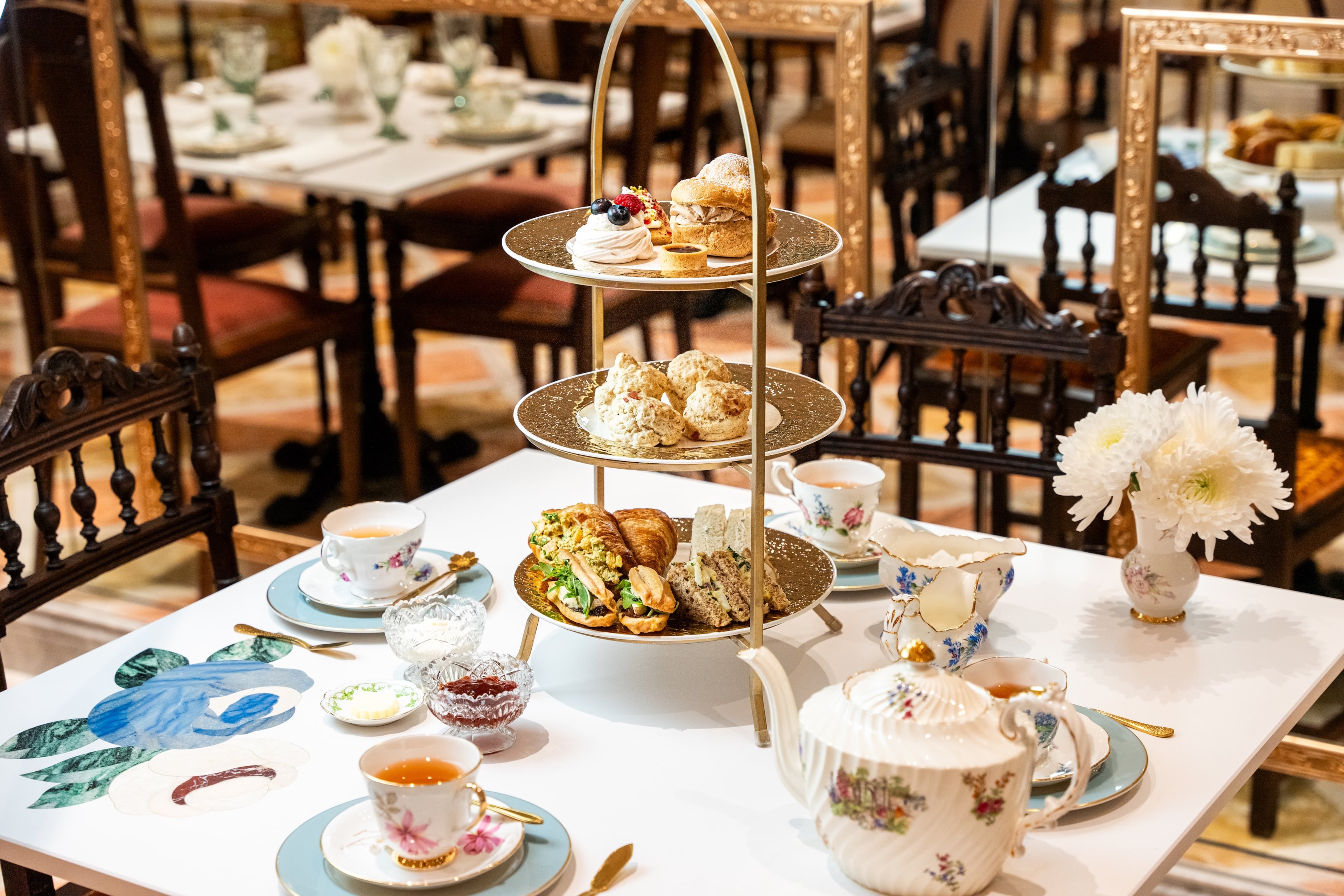 The high tea service at Le Faucheur includes a three-tiered stand filled with both savory and sweet snacks. (Courtesy of Daniel Fatemi, Le Faucheur)
