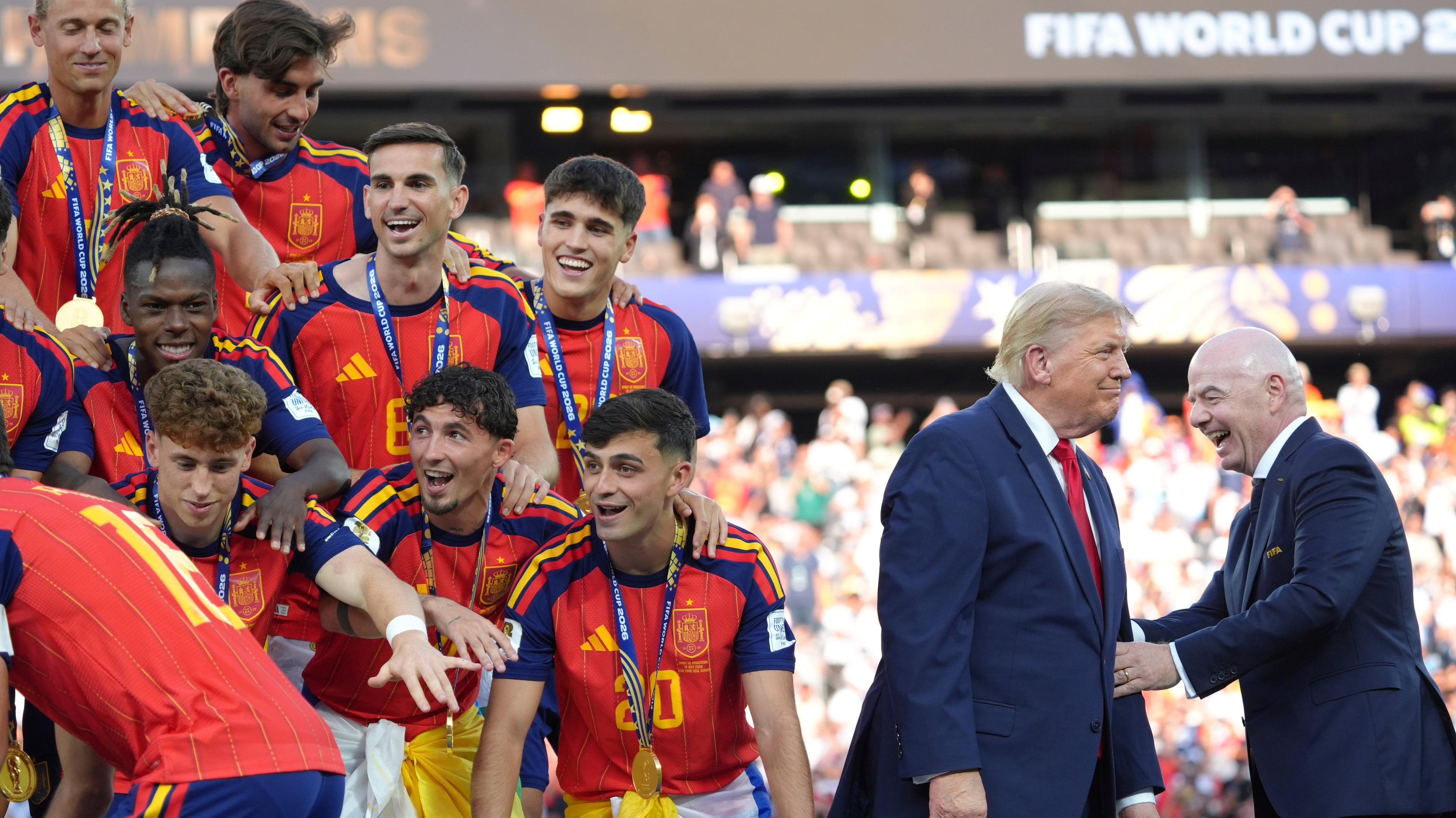 Spain players, from left, cheer alongside President Donald Trump and FIFA President Gianni Infantino at the conclusion of the World Cup championship final soccer match between Spain and Argentina in East Rutherford, N.J., Sunday, July 19, 2026. (AP Photo/Jacquelyn Martin)