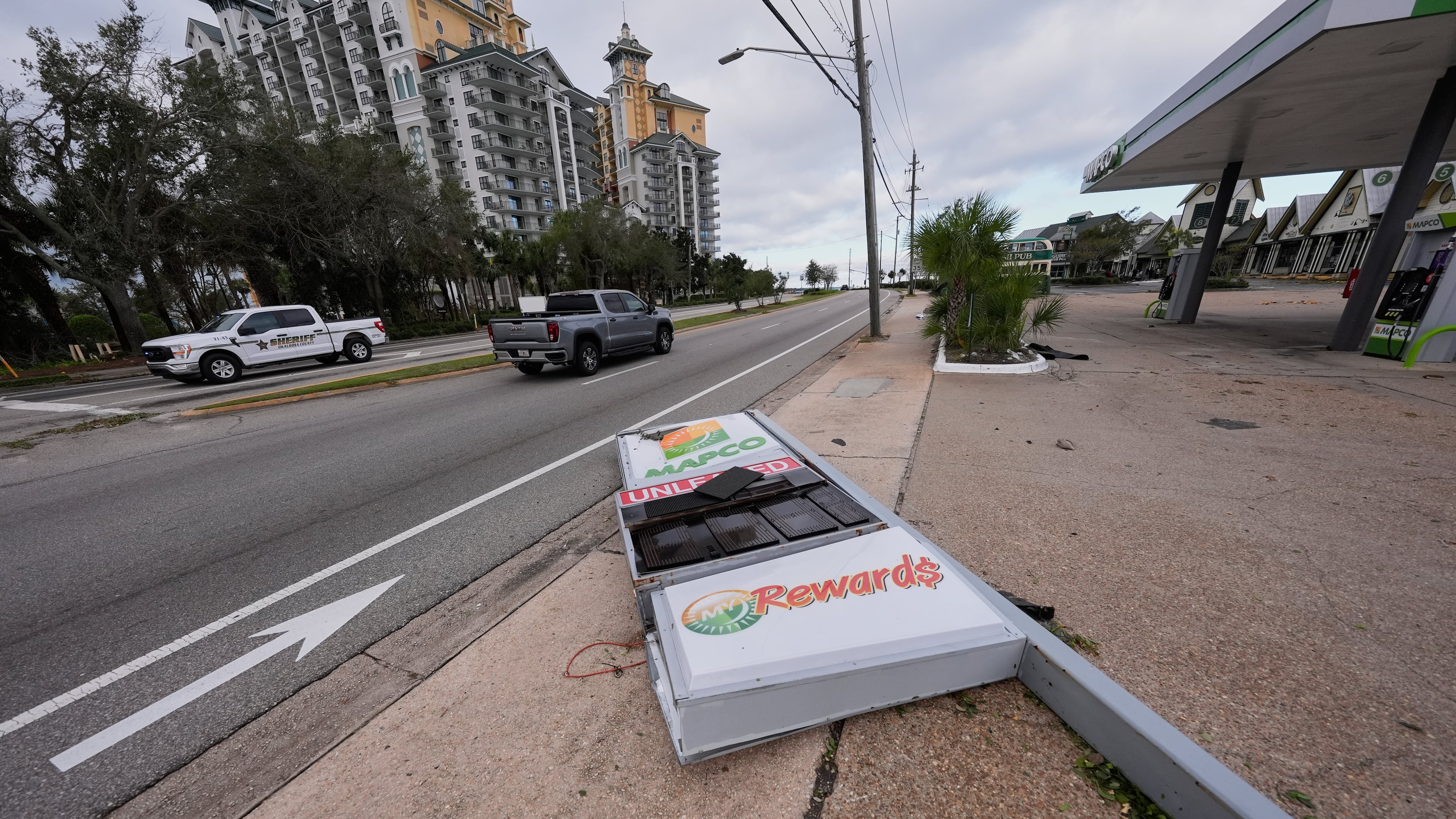 A gas station sign that was knocked down lies near the roadway in the aftermath of Hurricane Isaias in Destin, Fla., Saturday, Oct. 10, 2026. (AP Photo/Gerald Herbert)