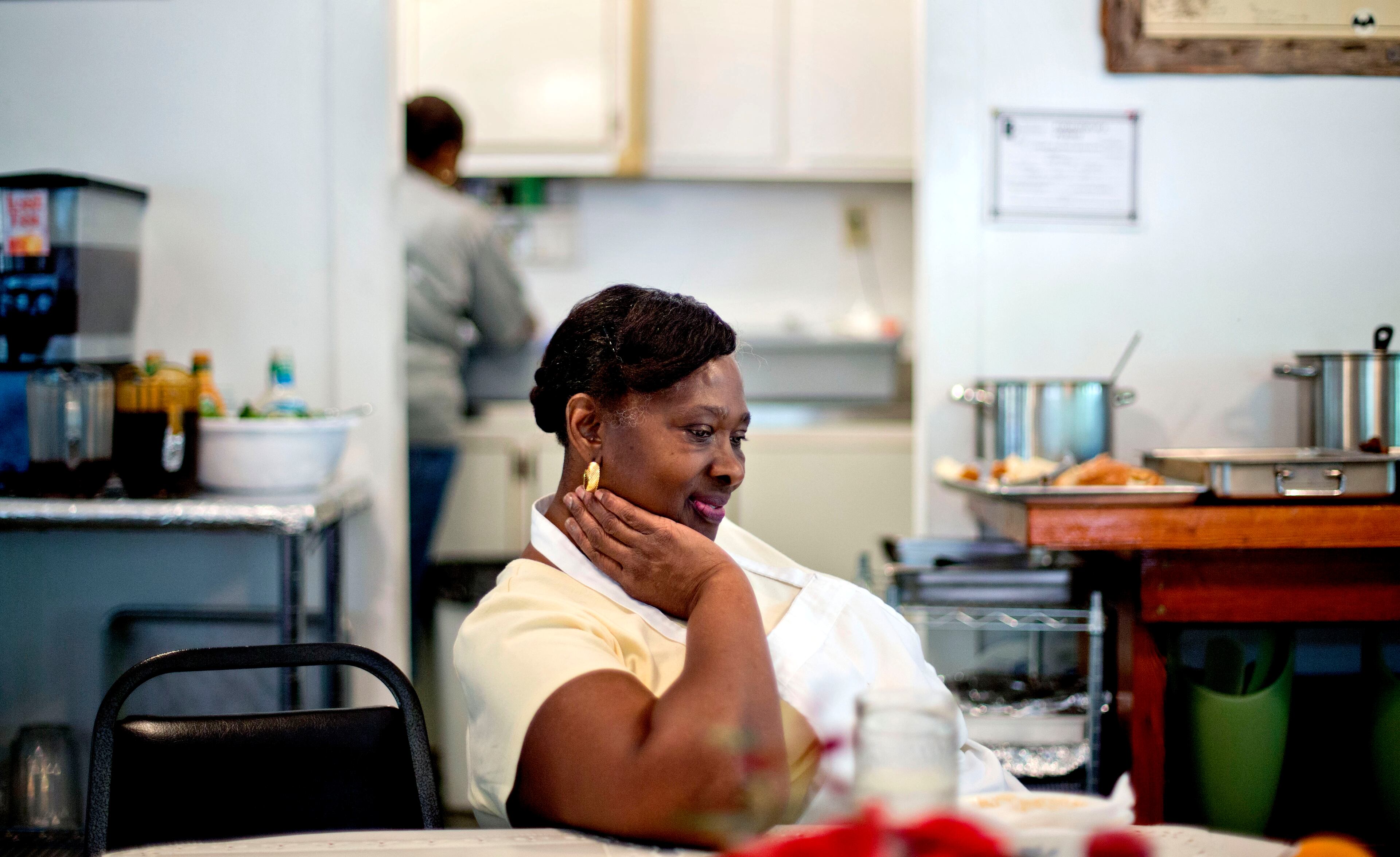 Lula Walker, 65, owner of Lula's Kitchen, rests after serving lunch to a tour group as her granddaughter Stephanie Grovner, 21, helps in the kitchen in the only restaurant in the Hog Hammock community of Sapelo Island, Ga. on Wednesday, May 15, 2013.
