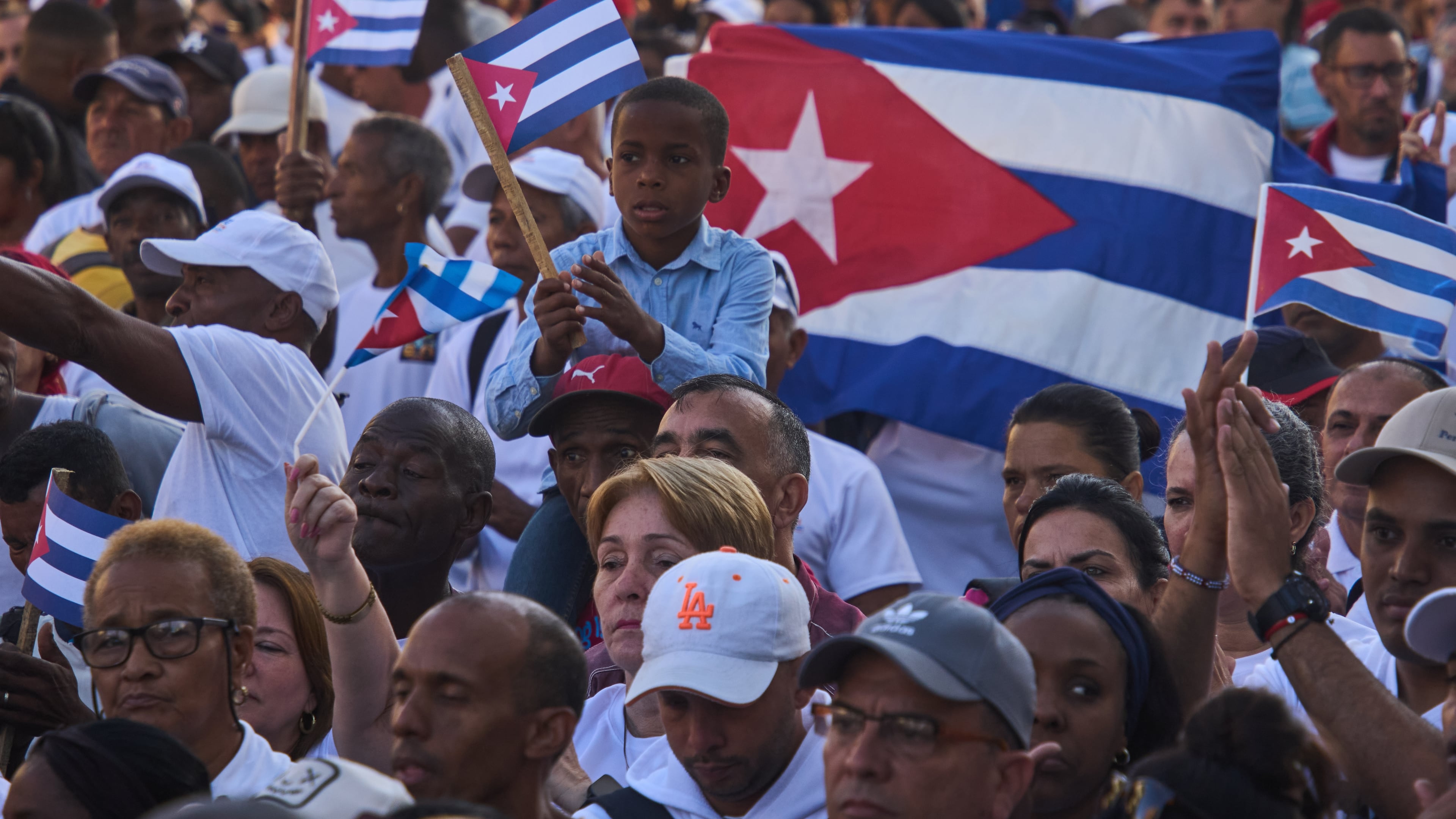 People attend a celebration marking the 65th anniversary of the proclamation declaring the Cuban Revolution socialist, in Havana, Cuba, Thursday, April 16, 2026. (AP Photo/Ramon Espinosa)