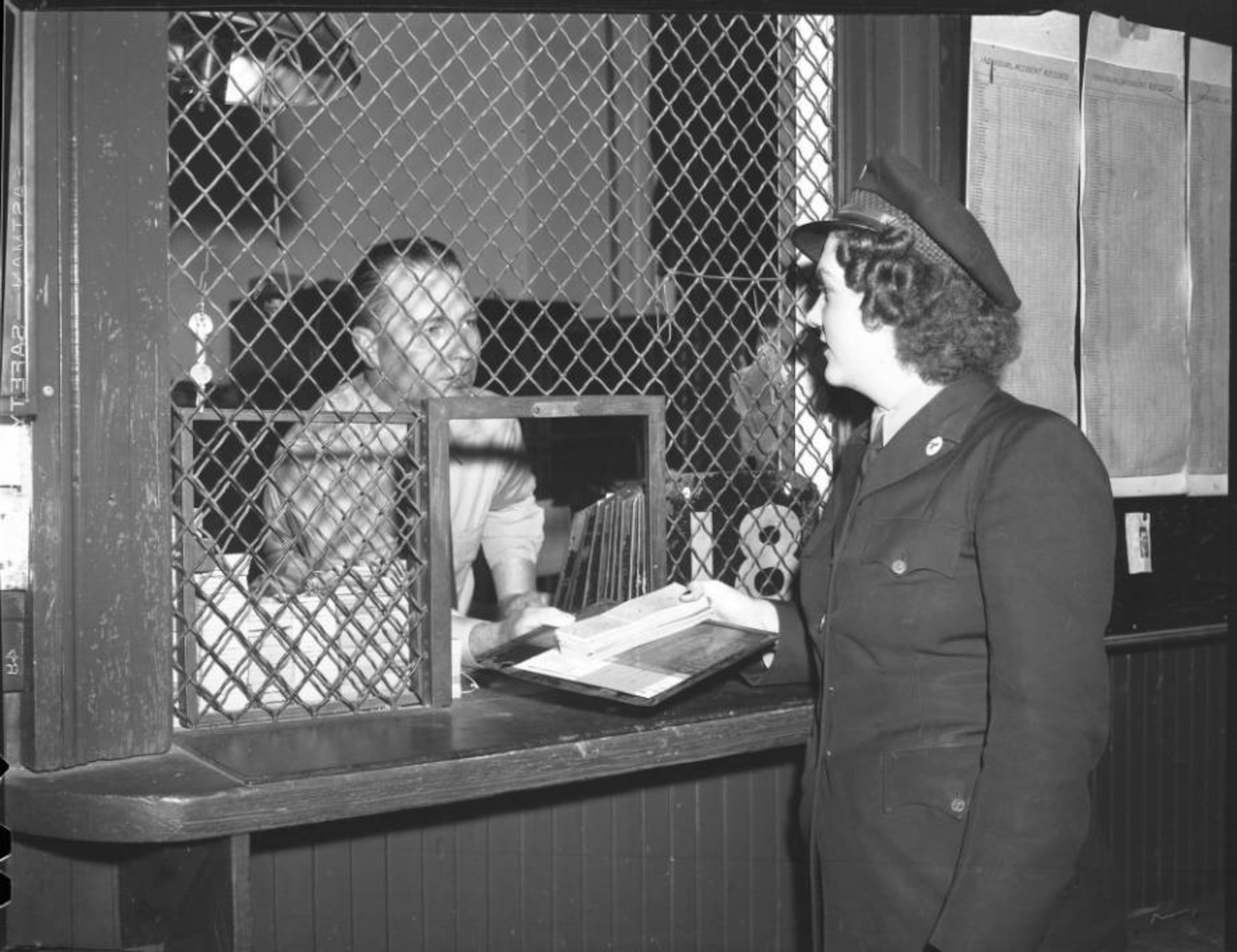 A female street car conductor arrives at work in Atlanta, January 1945. AJC file