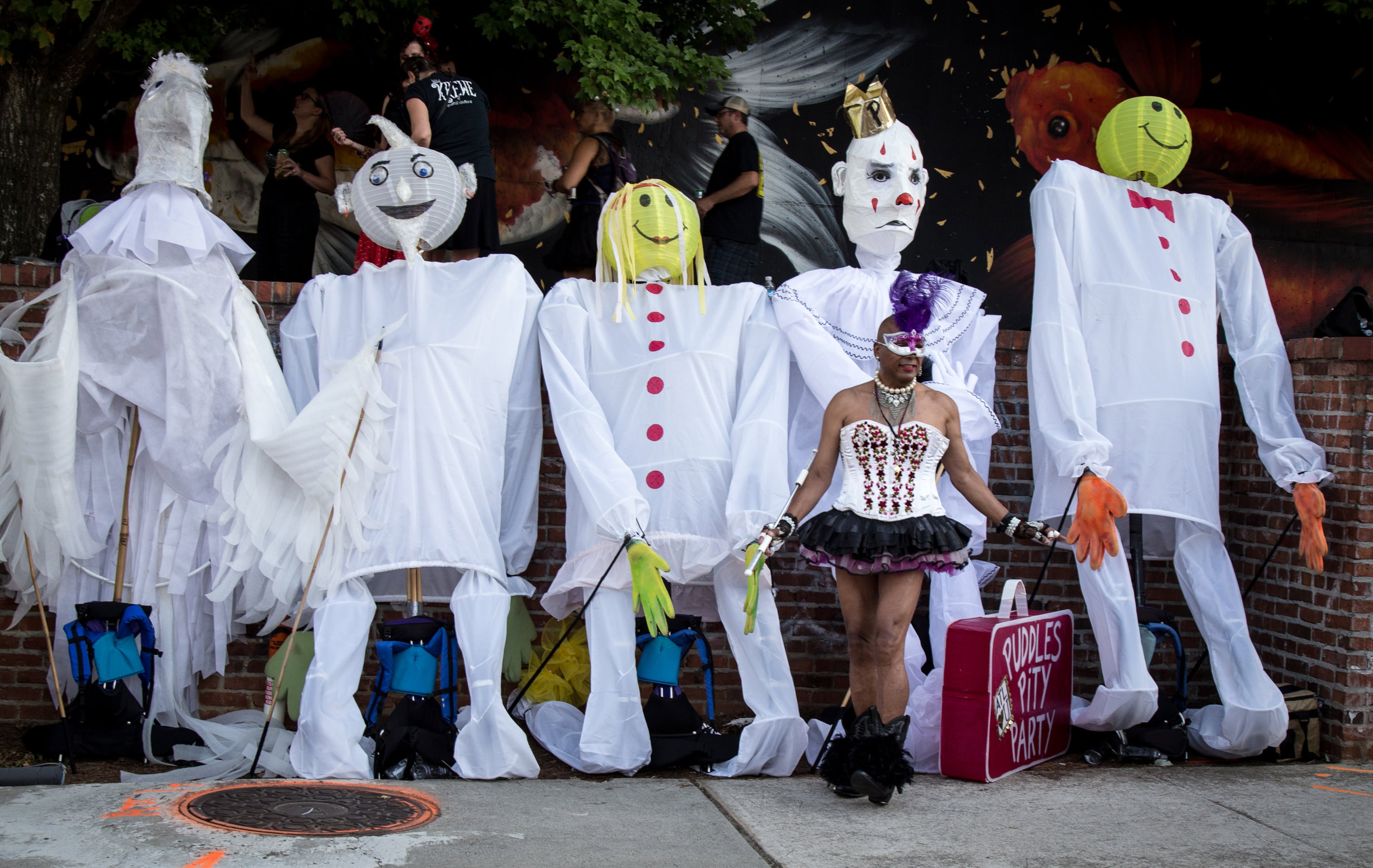 Baton Bob poses for a photograph in front of some large lanterns before the start of the Atlanta Beltline Lantern Parade on Saturday, September 22, 2018. (Photo: STEVE SCHAEFER / SPECIAL TO THE AJC)
