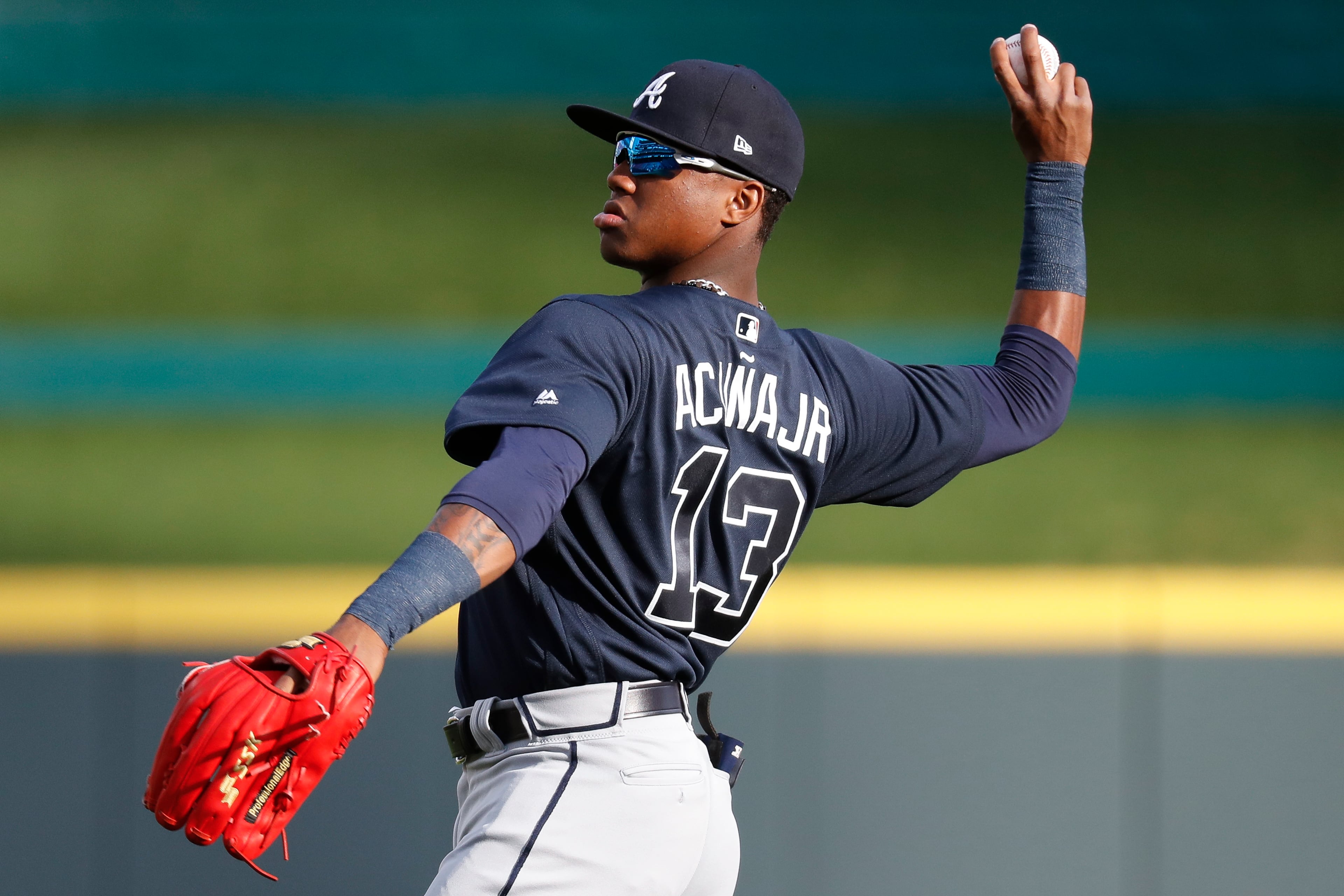 Atlanta Braves center fielder Ronald Acuna Jr. warms up for the team's baseball game against the Cincinnati Reds, Wednesday, April 25, 2018, in Cincinnati. (AP Photo/John Minchillo)