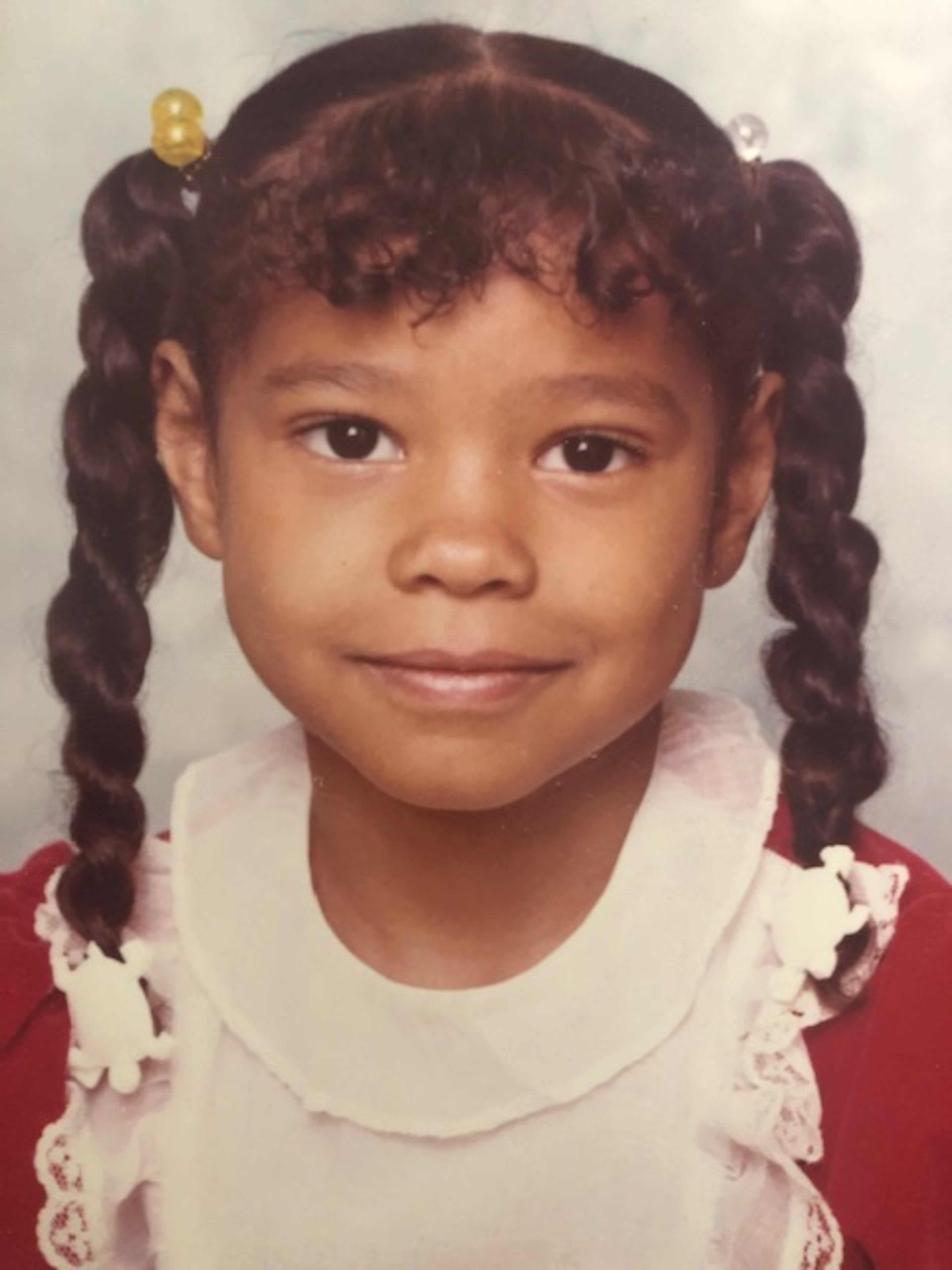 “We lived in a predominantly Black neighborhood, but we always understood both worlds,” says Kristy Reese, shown here in elementary school. (Courtesy of Kristy Reese and Kimberly Gibbs)