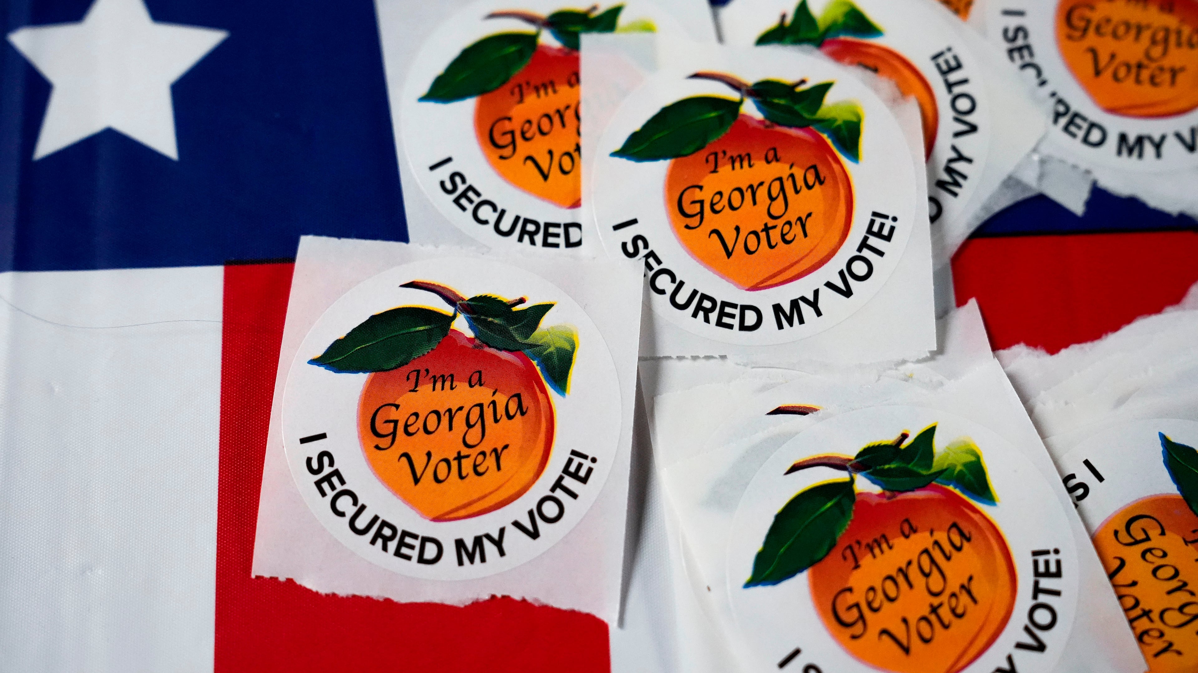 FILE - Stickers sit on a table inside a polling place, Nov. 5, 2024, in Atlanta. (AP Photo/Brynn Anderson, File)