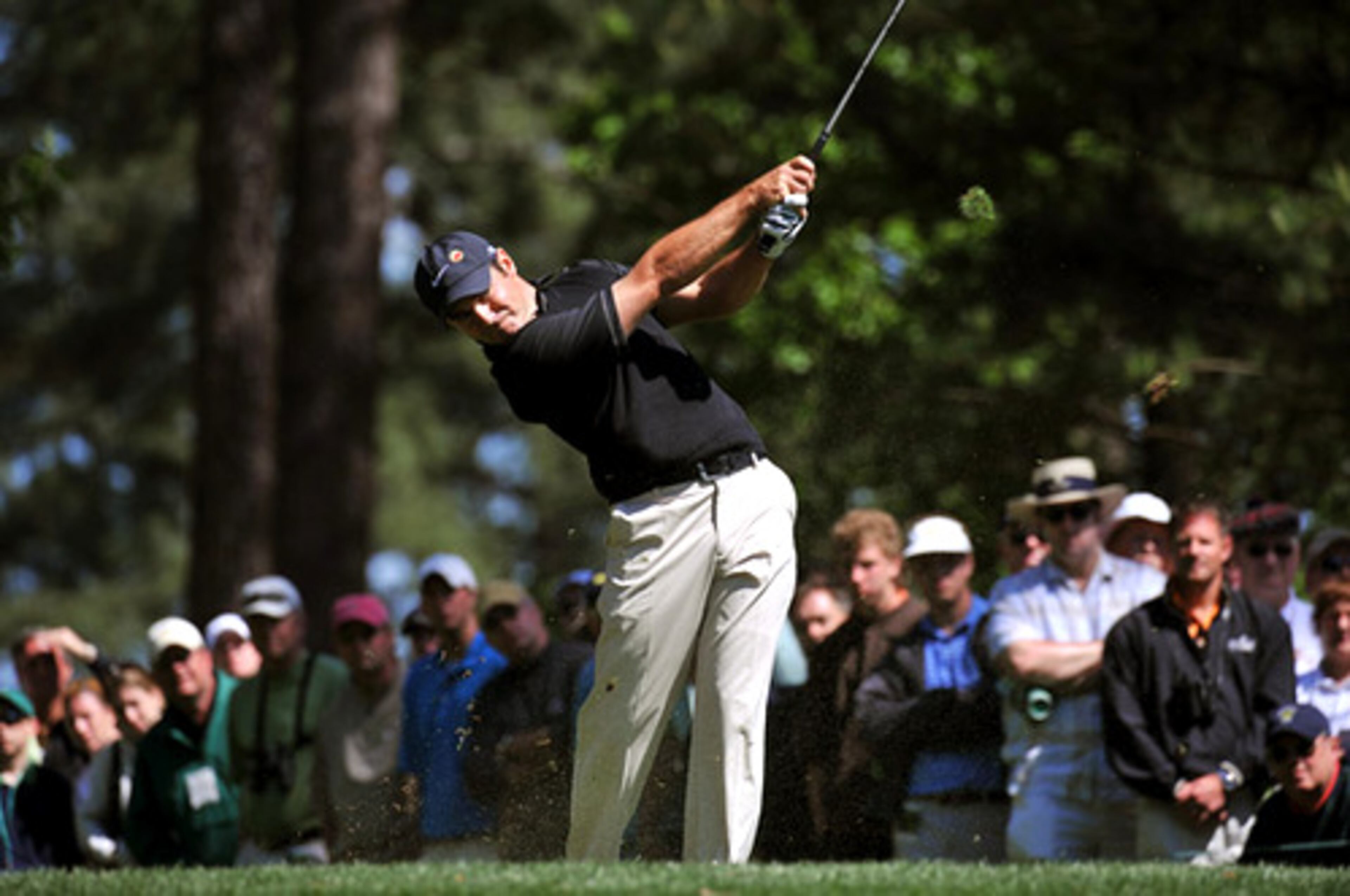 Immelman's iron shot from the 4th tee box causes the grass to fly too.