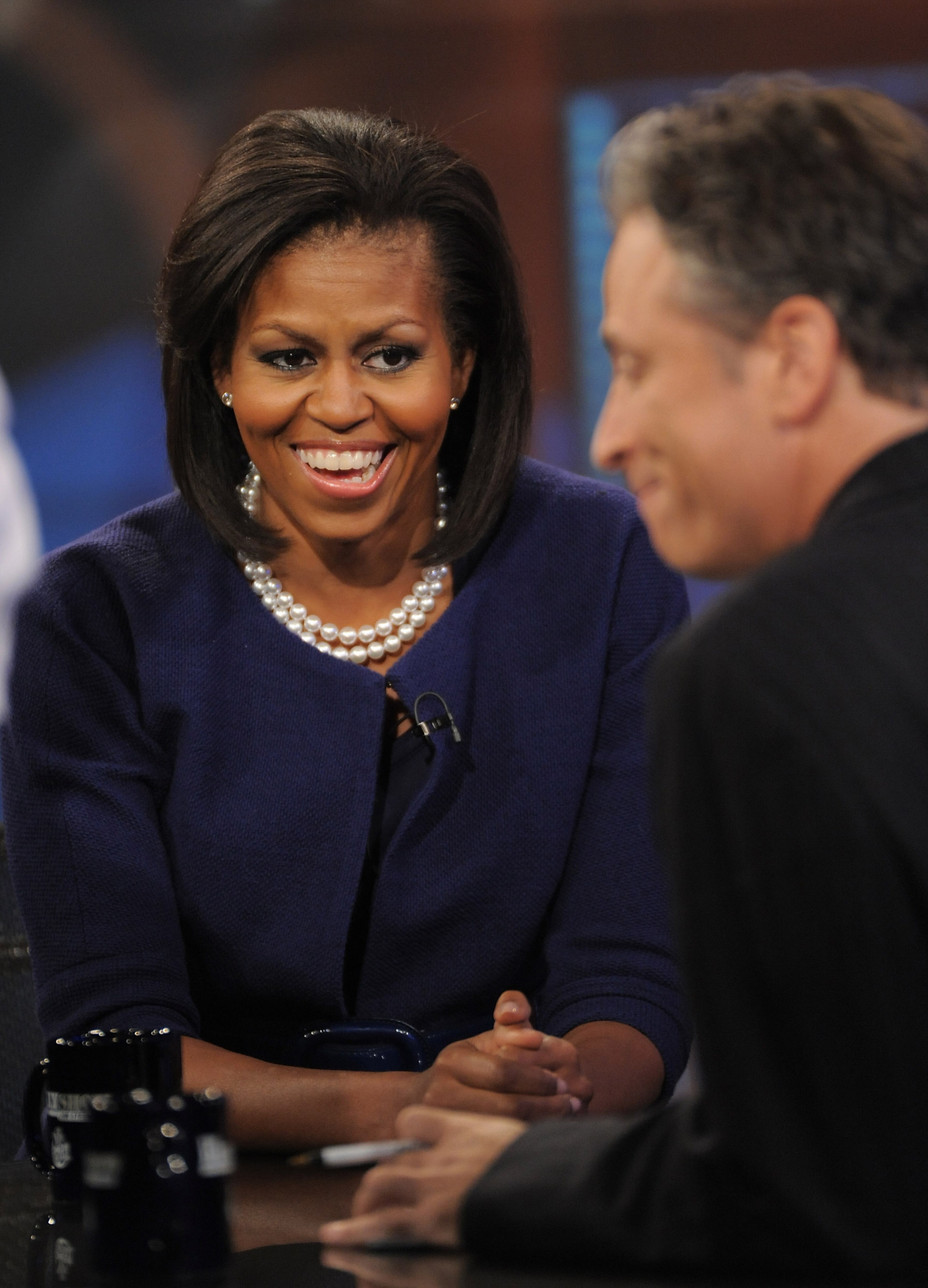 Michelle Obama, wife of Democratic presidential candidate Sen. Barack Obama, makes an appearance on 'The Daily Show with Jon Stewart' on Wednesday, Oct.8, 2008 in New York. (AP Photo/Evan Agostini)