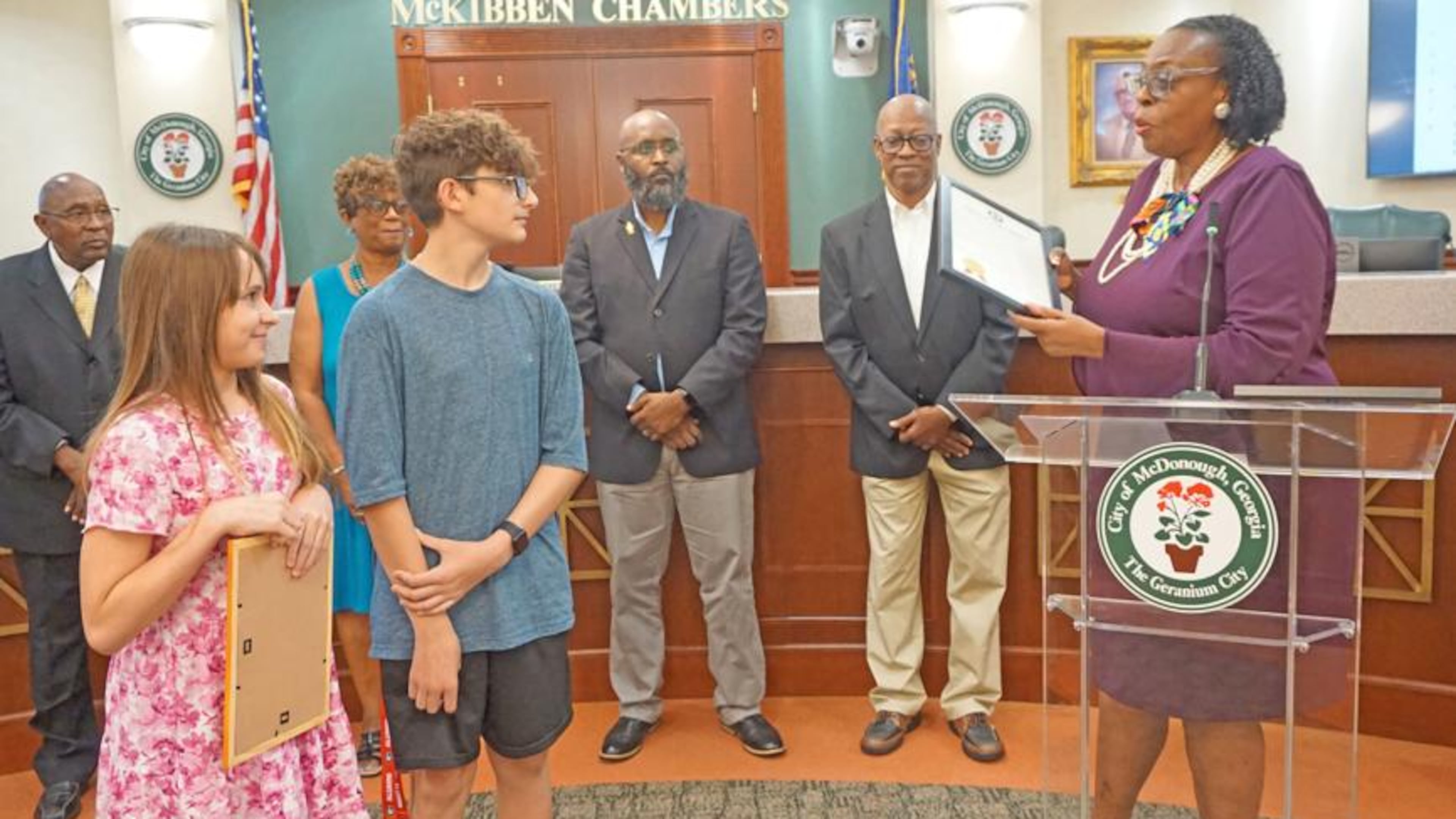 During the July 22 McDonough City Council meeting, Mayor Sandra Vincent recognizes Brantley Abbott for her life-saving efforts. (Courtesy of City of McDonough)