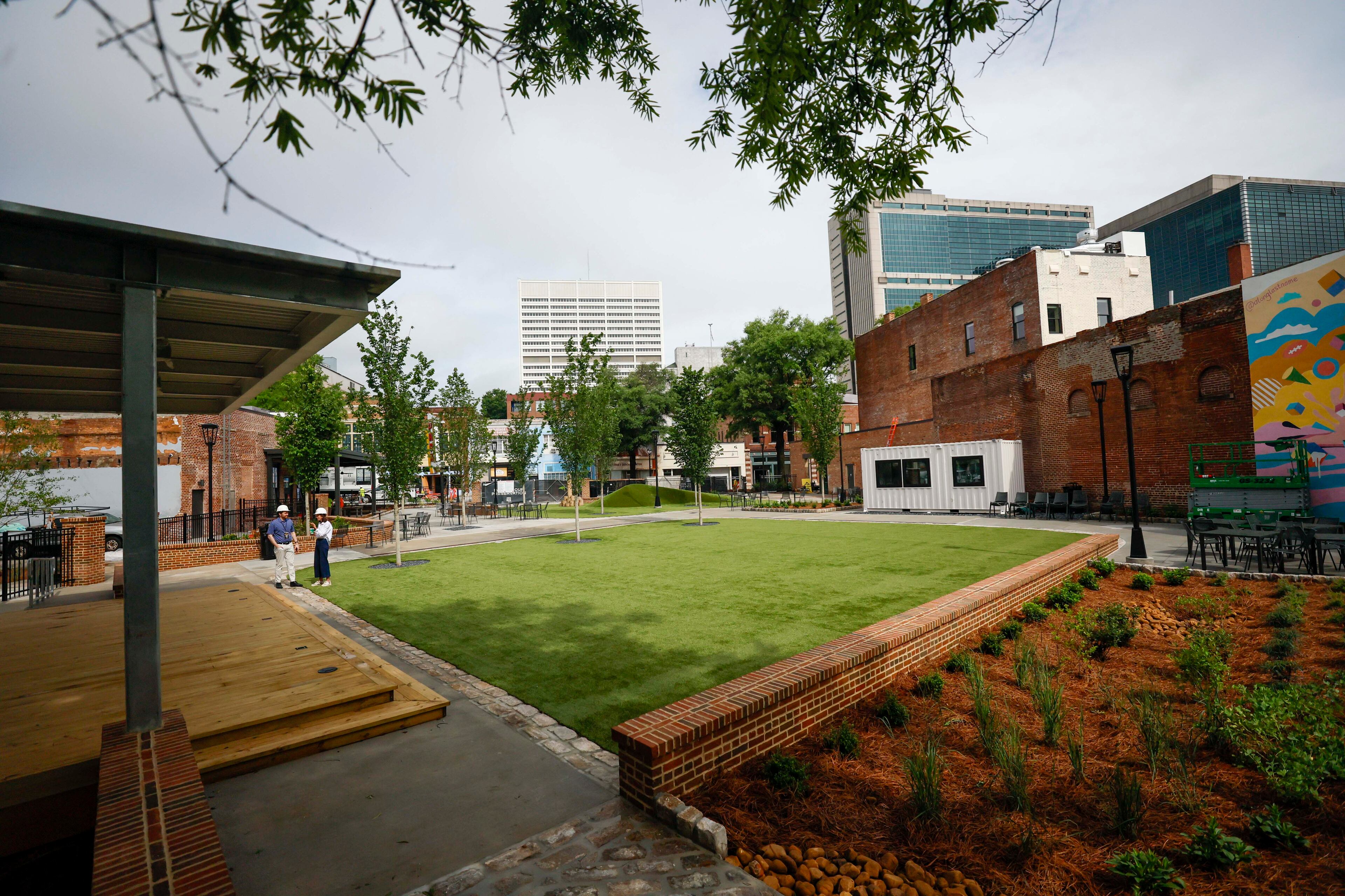The Founders Green is a space created to bring the community together as part of the South Downtown Atlanta revitalization, as seen on Wednesday, May 27, 2026. More than 50 historic buildings are being restored to include retail spaces and residences in one of Atlanta’s most ambitious downtown projects. (Miguel Martinez/AJC)