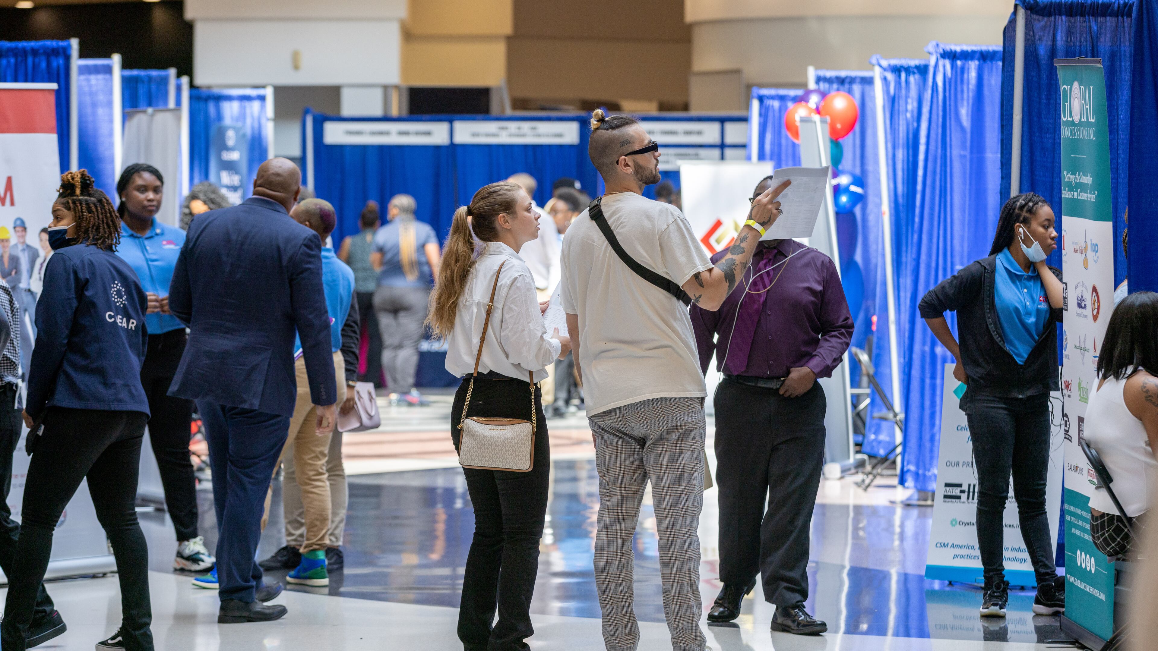 People walk around the domestic terminal atrium during the ATL Airport Career Fair at Hartsfield-Jackson Atlanta International Airport on Tuesday, June 14, 2022 (Steve Schaefer / steve.schaefer@ajc.com)